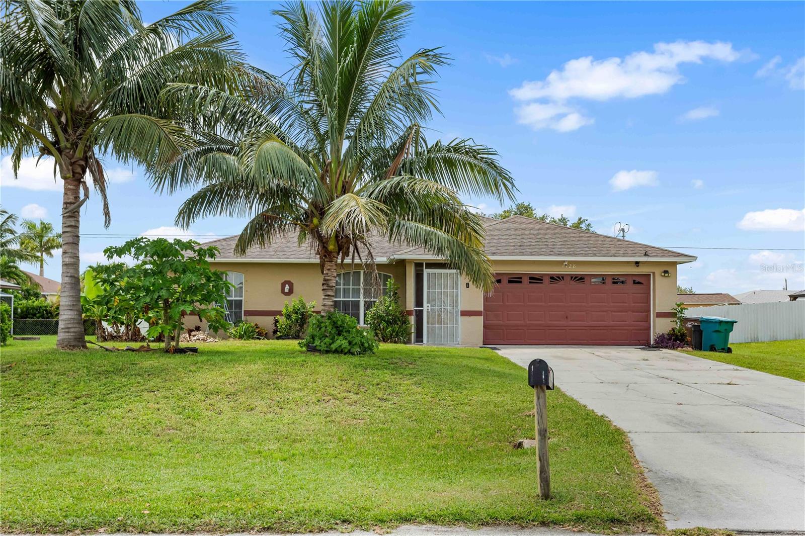 BIENVENIDA to your HOME in NE Cape Coral – NO FLOOD INSURANCE REQUIRED (Zone X)! This MOVE-IN READY PROPERTY offers COMFORT, SPACE, and a PRIME LOCATION with EASY ACCESS to Del Prado Blvd N (north-south) and Kismet Pkwy (east-west), putting you MINUTES from shopping, dining, schools, and all the BEAUTY SOUTHWEST FLORIDA PARADISE has to offer! OPEN LIVING AREA featuring a SPLIT-BEDROOM floor plan. The PRIMARY SUITE is privately located on one side of the home and features a HALLWAY ENTRY with the IN-RESIDENCE LAUNDRY AREA conveniently tucked away. On the opposite side, you’ll find TWO ADDITIONAL BEDROOMS joined by a JACL-N-JILL BATHROOM, plus a flexible den/home office/study that can also function as a FOURTH BEDROOM. Enjoy TILE FLOORING THROUGHOUT the entire home – PERFECT FOR FLORIDA LIVING! The SPACIOUS KITCHEN is designed with function and style in mind, offering plenty of GRANITE COUNTER SPACE, cabinets, a pantry, and NEWER STAINLESS-STEEL APPLIANCES including a large refrigerator/freezer, microwave, and dishwasher. The L-shaped layout flows into a dining area and breakfast bar, making this an ideal space for EVERYDAY LIVING or ENTERTAINING. SCREENED-IN LANAI with SOUTHERN EXPOSURE – a premium feature offering abundant NATURAL LIGHT throughout the day and IDEAL CONDITIONS for FUTURE POOL INSTALLATION or GARDEN SPACE - SEVERAL MATURE FRUIT TREES ALREADY IN PLACE for YOU TO ENJOY! ENJOY YOUR MORNING COFFEE OR EVENING BREEZE IN PEACE AND PRIVACY! KEY FEATURES INCLUDE Newer Roof (2019), Newer A/C System (2021), Tile Floors Throughout, 2-Car Garage plus Concrete Driveway, Screen-Enclosed Lanai, Spacious Backyard – Room for a Pool, 0.23-Acre Lot (10,019 sq ft), 1,422 Sq Ft Under Air. Located in a residential neighborhood, yet close to all amenities: grocery stores, restaurants, medical facilities, and schools. The property also offers QUICK ACCESS to Pine Island Rd, connecting you to US-41 and I-75 for an easy drive to Fort Myers, Punta Gorda, Port Charlotte, Naples, Sarasota, and Tampa. TWO MAJOR AIRPORTS — RSW (Fort Myers) and PGD (Punta Gorda) — are also WITHIN REACH FOR CONVENIENT TRAVEL! Whether you’re looking for a PRIMARY RESIDENCE, SEASONAL HOME, or INVESTMENT PROPERTY, this home offers flexibility, space, and long-term value in SWFL PARADISE. Don't miss your chance to own a piece of SWFL PARADISE in CAPE CORAL! Schedule your SHOWING TODAY and SNATCH THIS OPPORTUNITY to MAKE THIS HOME YOURS!