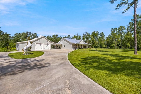 Photo of 10080 SE 1st Street Road, Silver Springs, FL 34488 (MLS # OM727438)