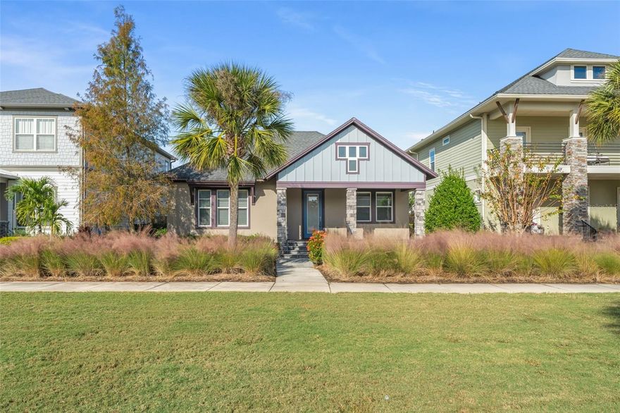 Located in the heart of Laureate Park just minutes from Lake Nona Town Center, this stunning David Weekley home (Fogel II floorplan), built in 2017, offers 4 bedrooms plus a bonus room, 3.5 bathrooms, and over 3,000 square feet of well-designed living space, including a garage apartment. The home faces a peaceful greenspace, providing a serene front yard and added privacy, perfect for enjoying your morning coffee on the spacious pavered front porch while overlooking the open lawn or watching your pets play. Inside, you’re greeted by a bright open-concept layout with ceramic tile flooring throughout, where the kitchen, living, and dining areas flow seamlessly together. A set of double French doors off the foyer reveals a versatile bonus room ideal as a home office or an extra bedroom. Two comfortable guest bedrooms share their own wing at the front of the home along with a full bathroom (tub/shower combo) and a flexible retreat space perfect as a playroom, media room, or second office, while a convenient half bath is tucked off the hallway for guests. The gourmet kitchen overlooks the living and dining areas and boasts 42-inch solid wood espresso cabinetry, granite countertops, a subway tile backsplash, stainless steel appliances (including double ovens and a range hood), and a large pantry, a chef’s dream that makes entertaining a delight. Toward the rear of the home, the spacious primary suite is tucked away for privacy, featuring a soaring tray ceiling with plenty of room for a king-size bed. Its en-suite bathroom offers a dual-sink vanity, a large walk-in shower with a rainfall showerhead and glass enclosure, a private water closet, and an enormous walk-in closet to accommodate the grandest wardrobe. A dedicated laundry room is accessible from both the living area and the primary bathroom for added convenience. Stepping outside, you’ll find a covered lanai with pavers and ceiling fans, an inviting outdoor living space perfect for relaxing or even an outdoor kitchen, that connects to the attached three-car garage. Above the garage is a fully equipped apartment with its own private entrance off the driveway, making it an ideal guest suite, home office, or rental unit to offset expenses. This recently updated garage apartment features a new kitchen with wood cabinetry, quartz countertops, and stainless steel appliances, plus a privacy wall creating a separate bedroom area, a walk-in closet, a laundry closet with a stackable washer and dryer, and a full bathroom with a tub/shower. As a resident of Laureate Park, you’ll enjoy fantastic community amenities, including a resort-style aquatic center with multiple pools, a state-of-the-art fitness center, numerous parks and playgrounds, and miles of walking/biking trails. The community’s own Canvas Restaurant & Market is just a short walk away, and you’re only minutes from the Lake Nona Town Center’s high-end restaurants, shops, and array of year-round events. Top-rated schools (all A-rated) for every grade level are within a mile of the home, and with quick access to the 417 toll road and Orlando International Airport, commuting or traveling is a breeze. Come see why this exceptional home, offering the perfect blend of luxury, flexibility, and location, could be the perfect fit for you.