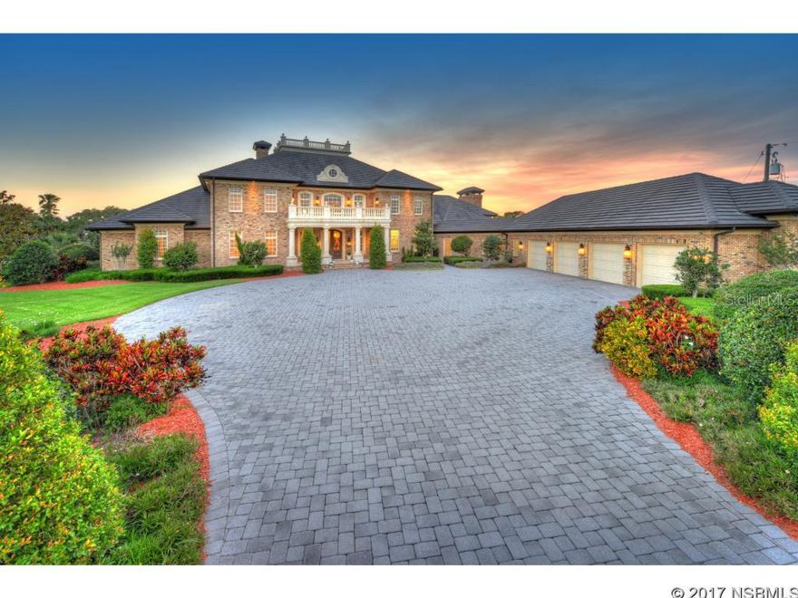 Video a MUST SEE! Magical, calming, Intracoastal Waterway views captivate you in this stunning 20,200 SF waterfront estate situated on 3+ acres. This 2008 home is designed for the modern lifestyle, boasts the best of quality in architectural design, construction, luxury features, smart home technology featuring energy efficient geothermal design. Upon entering, the grand foyer with crystal chandelier, twin curved staircases and spectacular water views will take your breath away. No space will go unused in the four level home as all levels are accessible by both elevator or steps. The main level offers 3 bedroom suites for your guests, a parlor, formal dining room, gourmet kitchen, family room, laundry room and powder room. The gourmet kitchen with custom 11x7 pantry offers easy entertaining around the 14x5 island with full sink and custom cabinetry. A second smaller bar adjacent to the farmhouse sink can be used for smaller groups. The kitchen flows to the fabulous family room featuring solid wood beams, 2 chandeliers, bay window and wood burning fireplace. The butler's kitchen/laundry room boasts custom cabinetry, sink, full refrigerator, freezer and pantry. The kitchen, family room and laundry room all feature brick flooring. The next level offers a jaw dropping owner's suite and nothing else with an over sized 44x20 bedroom with sitting area and fireplace, fully equipped morning kitchen, laundry room, his and her custom CA closets, his and her bathrooms which both offer jetted tubs, walk in showers and spectacular views. Above this level you will find a 24x22 bar and game room, office, powder room and walk-in, air-conditioned attic. The basement level affords space for a game room, exercise room, powder room and more. The four bay garage plus room for workshop won't disappoint with private office, full bathroom, tons of natural light and custom storage closets. ;Water: City