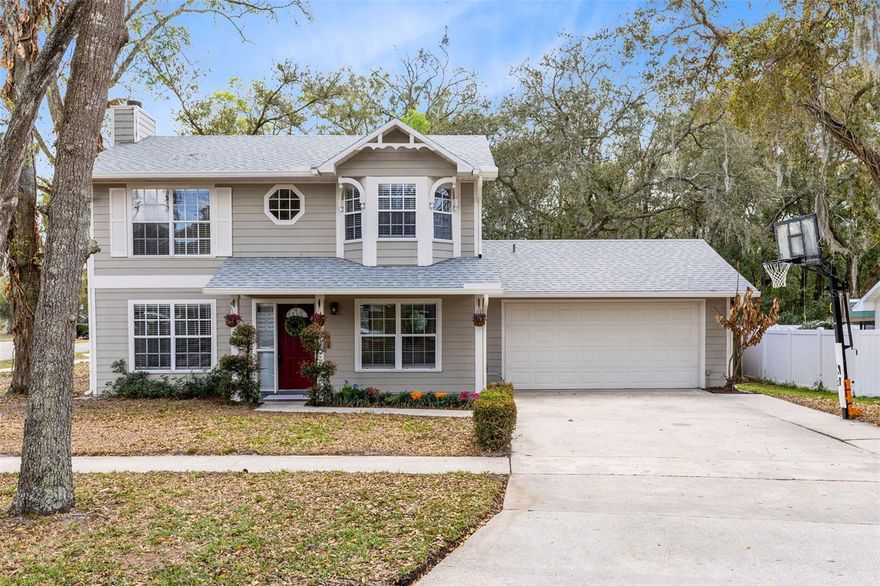 Welcome home to this beautifully maintained 3-bedroom, 2.5-bath residence with NO HOA, ideally located in a quiet Sanford neighborhood zoned for highly regarded Lake Mary schools. With charming curb appeal, a covered front porch, and an extended driveway, the home offers both warmth and functionality from the moment you arrive.

Inside, the inviting layout features engineered wood flooring, crown molding, and a cozy living room anchored by a fireplace with stone surround—perfect for relaxing evenings or gathering with friends. A formal dining room provides an elegant space for hosting holiday meals and special occasions.

The heart of the home is the thoughtfully designed kitchen featuring raised-panel cream cabinetry with contrasting dark hardware, granite countertops, stainless steel appliances, a stone tile backsplash, and a double stainless sink. The bay window breakfast nook with built-in bar counter creates a bright and comfortable spot for morning coffee, casual dining, or entertaining.

A versatile first-floor study, den, or movie room with ceiling-mounted projector and drop-down screen offers the perfect setting for movie nights, gaming, or a home office.

Upstairs, the primary suite offers a charming bay window bench nook—ideal for reading or relaxing—and a walk-in closet with its own window for natural light. The updated bath includes granite counters, and a beautifully tiled walk-in shower.

Step outside to enjoy a private backyard retreat featuring a screened porch, expansive paver patio with built-in fire pit, and a fully fenced yard with plenty of space to play, garden, or entertain. A separate shed with electrical power adds valuable space for a workshop, hobbies, or extra storage.

Recent improvements include roof replaced in 2020 (including porch enclosure roof), A/C and water heater from 2015, and a Nest smart thermostat.

Perfectly positioned near SunRail (0.6 mi), Groveview Park (0.6 mi), and the popular Lake Mary Saturday Farmers Market (0.9 mi), this home offers convenient access to parks, dining, community events, and commuting routes.