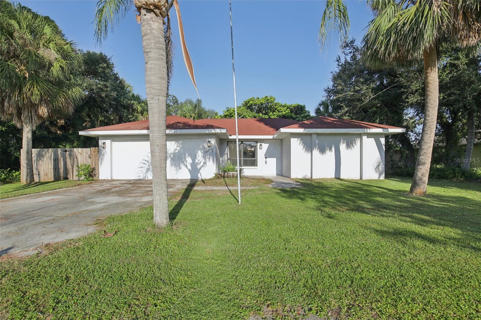 Welcome to this charming 2-bedroom, 2-bathroom home with a 2-car garage in the heart of North Port, Florida! Offering 1,178 sq. ft. of comfortable living space, this home is perfect for seasonal or year-round living. Step inside to a bright, open floor plan that flows seamlessly into the Florida room, providing extra living space to relax or entertain. Enjoy your morning coffee or evening breeze on the screened-in back porch, overlooking your private backyard. With a split-bedroom design, the primary suite offers comfort and privacy, while the second bedroom is perfect for guests or a home office. The 2-car garage provides ample storage and convenience. Located just minutes from shopping, dining, parks, plus easy access to the world-famous beaches of Sarasota County, this home is a wonderful opportunity to enjoy Florida living at its best!