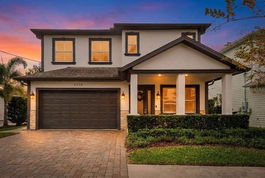 Perfectly positioned in the heart of South Tampa, this stunning 5-bedroom, 3.5-bath residence offers refined design, thoughtful upgrades, and exceptional indoor-outdoor living. Soaring 10-foot ceilings throughout, impact-rated energy-efficient windows, travertine living and dining areas, and custom plantation shutters create a bright, timeless aesthetic. A welcoming living room flows seamlessly into the gourmet kitchen, creating a comfortable and inviting space ideal for both everyday living and entertaining. The home features two expansive primary suites, one upstairs and one downstairs, each offering tray ceilings with custom lighting, dual walk-in closets, and spa-inspired ensuite bathrooms. The upstairs suite includes a soaking tub and walk-in shower, while the downstairs primary boasts a luxurious soaking Jacuzzi tub and walk-in shower, with direct access to the backyard from the bedroom. The chef-inspired kitchen anchors the home with granite countertops, 42-inch wood cabinetry, two kitchen islands, bar seating, and a wine fridge with wet bar. The fourth bedroom is currently utilized as a home office, offering flexibility for today’s lifestyle. The fifth bedroom has been transformed into a private golf simulator and media retreat, complete with a multi-media projector and in-ceiling speakers, offering an immersive space to practice your swing or enjoy cinematic movie nights. Bathrooms and the laundry room are finished in travertine, with the laundry area offering separate gas or electric connections. Outdoor living shines with ambient backyard lighting, a paver patio, and a custom-built pergola with a natural gas fireplace, where you can relax and entertain while enjoying the privacy of a completely fenced backyard. Major system upgrades include a 2016 roof, HVAC systems replaced in 2024 and 2025, engineered hardwood floors installed in 2021, a brand-new tankless gas water heater in 2025, and new dishwasher and refrigerator in 2025. The home is also equipped with an ADT security system, providing peace of mind and enhanced protection throughout. Ideally located just minutes from Bayshore Boulevard, South Howard’s renowned dining and nightlife, International Plaza, Downtown Tampa, and Tampa International Airport, this home places the best of South Tampa living within easy reach—schedule your private showing today to experience it for yourself.