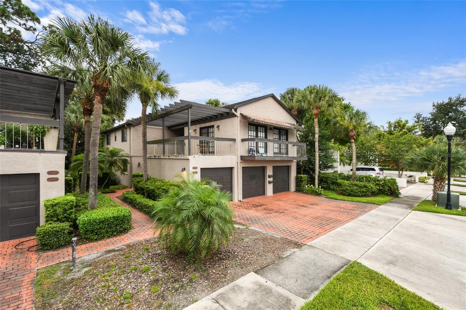 Location, location, location! Walk to Park Ave., Rollins, Winter Park Tennis Center, Mead Gardens and Foxtail Coffee and more! Hard to find 1st floor 2/2 with garage. Charming details include hardwood floors, fireplace in great room, updated kitchen w/stainless appliances and eat-in area. Split bedrooms; master has walk in closet, dual vanity and separate tub/shower/toilet room. Large paver patio for relaxing and entertaining. Single car garage, plus guest parking. Don't miss this one...