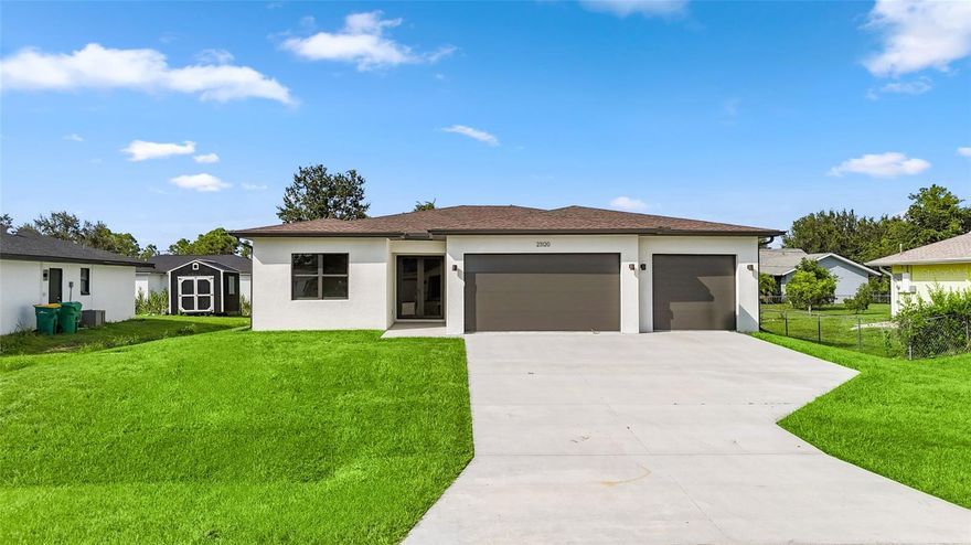 MOVE-IN READY 2025 BUILD WITH A 3-CAR GARAGE AND A FLEX ROOM YOU’LL ACTUALLY USE. Step into a bright, open great room framed by 10-foot ceilings and durable luxury vinyl flooring, flowing into a stylish kitchen with granite counters, stainless appliances, and an island designed for everyday living and effortless entertaining. A versatile front flex room adapts as a home office, formal dining, playroom, or media space—your call. The private primary retreat features a spacious spa-inspired bath with dual vanities and a walk-in shower with overhead rain and handheld spray, plus a large wardrobe closet to keep everything organized. Guest bedrooms sit on the opposite side for added privacy, with a centrally located laundry room offering access from both the foyer and the primary suite. Impact-rated windows and exterior doors add comfort and confidence, while the split 3-car garage delivers extra storage for vehicles, tools, and beach gear. Outside, the 80x125 homesite provides room for gardening, pets, and future outdoor upgrades—without the burden of HOA fees. Enjoy city water and sewer, and a convenient location near everyday shopping and dining along US-41, with quick access to area parks, boat ramps, golf, and all the Gulf Coast fun. Fresh, functional, and ready for your finishing touches—come see how well this one fits. This property would make a great annual rental!!