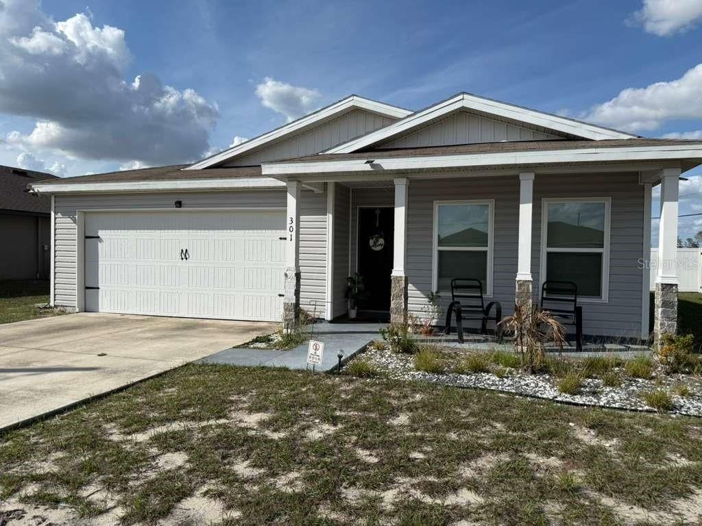 Photo of 301 Daffodil Lane, Poinciana, FL 34759 (MLS # S5145580)