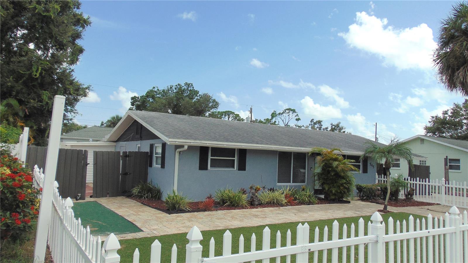 NEW ROOF being installed and will be finished by 9/7. Flood zone X so flood ins not required by lender. Sellers moved and can't complete a few projects that were in the works, so sellers priced home based on the need to finish them. Approx 1.5 miles to the beach ferry and boat ramp and about a mile to the amazing Shamrock Park with tennis, basketball, playgrounds and restrooms. Home has had the entire kitchen and both baths replaced. Also replaced most flooring, seller has remaining matching tiles to complete the rest of the rooms. Home has 2 central air conditioners both with smart T-states, both only 5 years old. Septic pumped out less than a year ago, well pump and well fittings replaced a few months ago and the water heater also less than a year old. Home used to have a full M-In-Law suite, but kitchenette removed and has been used as a huge master suite which also has a separate entrance and small office with its own smart T-stat. Or use as a 4-bedroom + office home. The price reflects the needed attention. Minimal work needed inside, mostly paint and install some base boards in the 2nd bedroom and office and finish flooring installation. Most work needed is in rear yard, Lania was to be enclosed which is why cuts in slab to reroute well PVC line around it before enclosing, was unable to complete. Old fence needs to be removed to expose rear neighbors' new fence and remove remaining amount of old pool decking. 2nd Driveway was poured right side of existing driveway 6" thick, all the way to the rear of the property to accommodate large multiple Trucks or RVs. Nice quiet street with minimal car traffic. You can join the "Voluntary" HOA to use the boat ramp and the beach ferry as well as their clubhouse and tennis courts, annual costs are around $70.00 per year pp. Property is vacant so can close quickly. Want it as an investment? Market rent is approx. $2100 pm on an annual lease. Pump and filter for the former pool still in place, was working fine last used, great for an above ground pool.