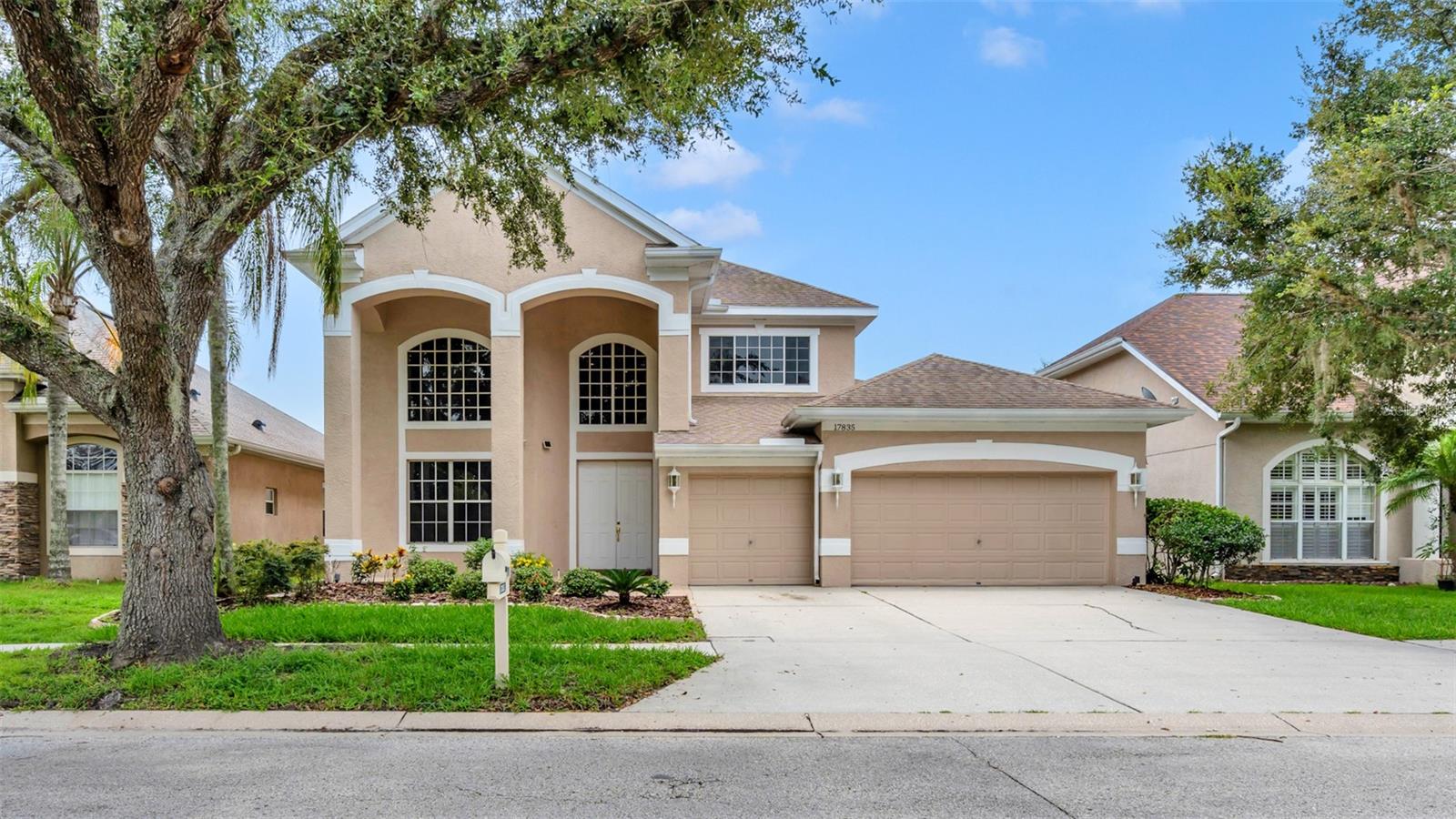 Elegant 4-Bedroom Home in Arbor Greene. This 3,500+ sq. ft. home features a dramatic 20-ft entry, spiral staircase, and serene pond views. Offering 4 bedrooms, a den/office/library, 4 baths, and a 3-car garage, it also includes a gourmet kitchen with granite prep island and Corian counters. The owner’s suite boasts a tray ceiling, sitting area, jetted tub, and large walk-in closet. Formal living and dining spaces make entertaining a pleasure.
Upstairs, a spacious loft with storage leads to three bedrooms. Two share a Jack-and-Jill bath with walk-in closets, while the third has a private bath—perfect as a second master or mother-in-law suite.
Additional features include a family room with triple sliders to a screened lanai overlooking the pond, Italian porcelain tile, EV Tesla charger, and water softener.
Community Amenities: Fitness center, basketball courts, playground, dog play areas, clay tennis courts, and an Olympic-size swimming pool.
Located in a gated community near shopping, dining, USF, and top medical facilities. Call today to schedule your visit!