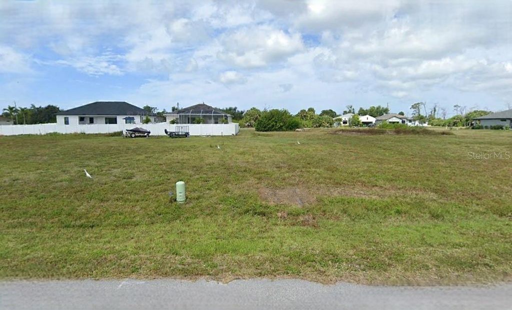 Photo of 116 Temper Lane, Rotonda West, FL 33947 (MLS # O6289461)