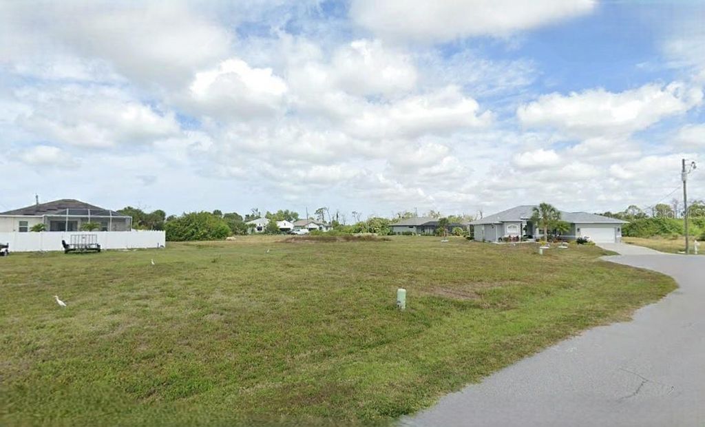 Photo of 116 Temper Lane, Rotonda West, FL 33947 (MLS # O6289461)