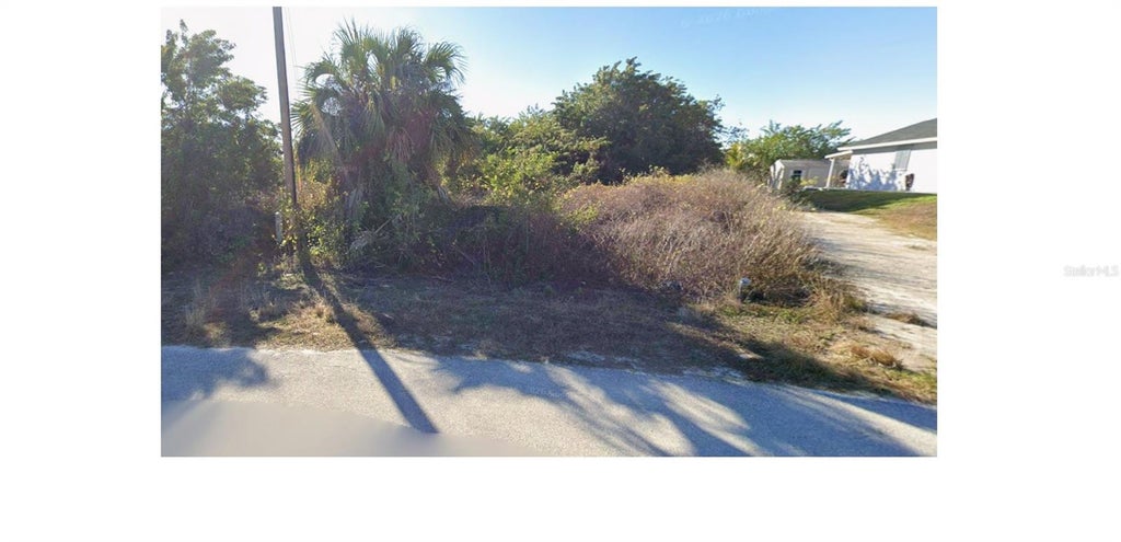 Photo of 537 Kingsbury Lane, Lehigh Acres, FL 33974 (MLS # A4705791)