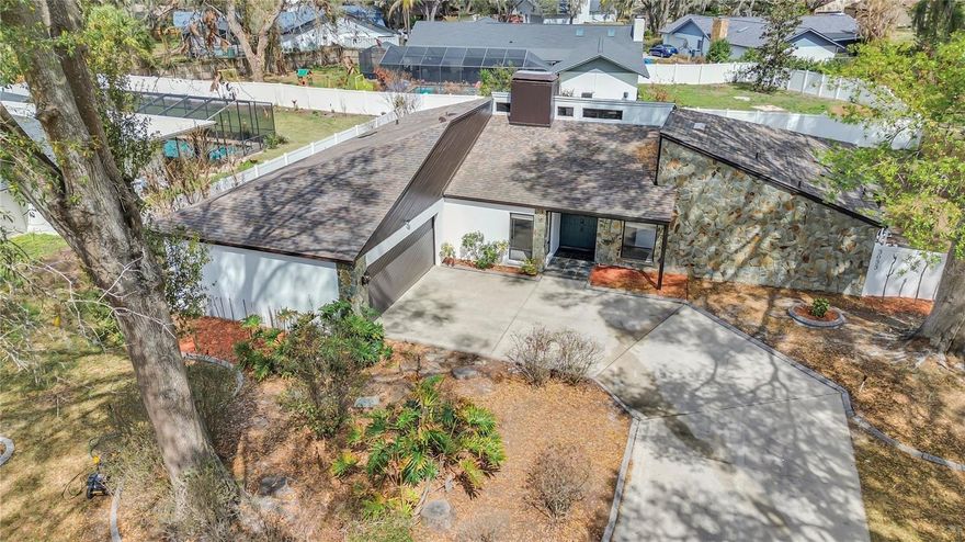 One or more photo(s) has been virtually staged. Welcome to this beautifully remodeled 4-bedroom, 2-bath home offering 2,415 square feet of bright and inviting living space in the heart of Valrico. Designed with both comfort and entertaining in mind, this move-in-ready home features an open-concept layout that seamlessly connects the spacious family room and the stunning kitchen.

The kitchen serves as the centerpiece of the home with a large center island, perfect for gatherings, casual meals, and hosting family and friends. Skylights placed throughout the home flood the interior with natural light, creating a warm and airy atmosphere where lights are rarely needed during the day.
The private primary suite offers a peaceful retreat with direct access to a side patio featuring an in-ground jacuzzi, providing the perfect space to relax and unwind.
Major updates have already been completed for peace of mind, including a new roof, new A/C system, and new water heater.
With its modern upgrades, abundant natural light, and ideal layout for entertaining, this beautifully updated home offers the perfect blend of style, comfort, and functionality in a desirable Valrico location.