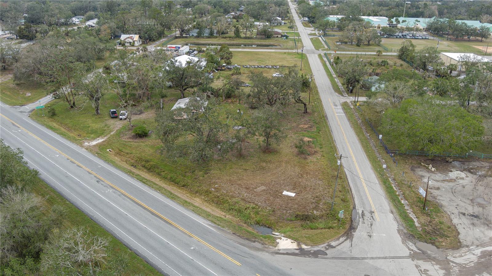 Discover an incredible opportunity to own almost 1.5 acres of prime real estate at the highly visible corner of State Road 70 and Singletary Road in Myakka City, Florida. This property is perfectly positioned in an area experiencing exciting growth, with a mix of residential and commercial development reshaping the community.
The property is already zoned Village, allowing for a variety of permitted and special uses under Manatee County regulations, making it ideal for investors or business owners looking to capitalize on this strategic location. Whether you're considering retail, office space, or other ventures, this corner lot provides the flexibility to bring your vision to life.
Adding to its appeal, Singletary Road is quickly becoming a hotspot for high-end development. Several state-of-the-art golf courses are being constructed just down the road, drawing attention and increasing traffic to the area. Nearby amenities include a newly opened Dollar General and gas stations, providing added convenience and ensuring that this lot is surrounded by bustling activity.
Offered at $675,000, this property represents an exceptional value in one of the most promising up-and-coming areas of Myakka City. Don’t miss the chance to secure your piece of this rapidly developing community.
For more information or to schedule a viewing today!
Sold as package --- Parcel IDs/Addresses: 189800039 - 37015 SR 70 E, MYAKKA CITY, FL 34251; 189800129 - ROOSEVELT RD, MYAKKA CITY, FL 34251; 190400002 - 10550 WAUCHULA RD, MYAKKA CITY, FL 34251; 189300007 - 37081 ROOSEVELT RD, MYAKKA CITY, FL 34251; 190300004 - 10580 WAUCHULA RD, MYAKKA CITY, FL 34251; 189400005 - 10570 WAUCHULA RD, MYAKKA CITY, FL 34251