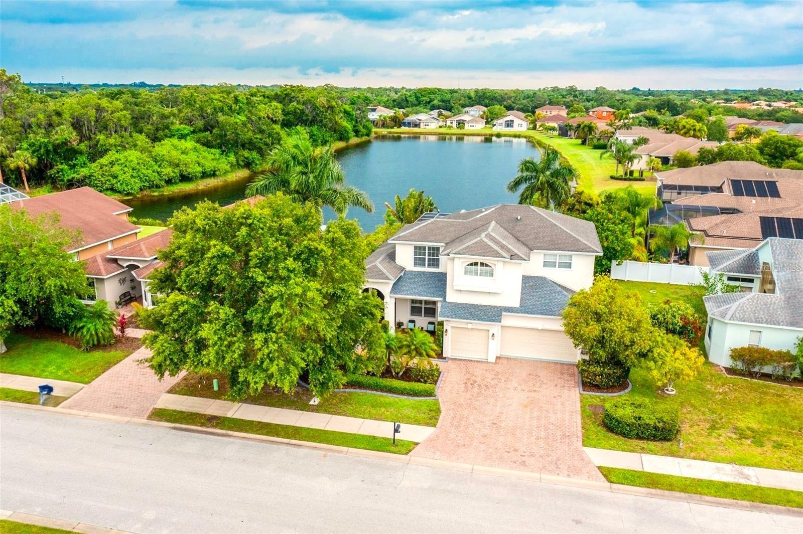 Sarasota Annual Unfurnished Single-Family Pool Home! Centrally located between Sarasota and Manatee counties and situated in the beautiful Riomar Community. AVAILABLE OCT 10, 2025. This exquisite home offers both luxury and convenience. There are 5 bedrooms, 4 bathrooms, and an extended, screened lanai with a sparkling heated saltwater pool and spa, overlooking the serene lake and views of the lush tropical landscaping. The Master bedroom is located on the ground floor, it has two walk in closets equipped with California closet systems, the renovated master bath features two custom-built vanities with soft close drawers and quartz counter tops. Porcelain tile floors, and a large rain shower, plus separate soaking tub. As you make your way up the beautiful staircase to the second floor, there is wood-look luxury vinyl flooring throughout every room. The 4 additional bedrooms and a bonus room provide ample space for guests, a home gym or leisure room. On the ground floor, there is also an office with built in office furniture, ready for home-office worker! The home also has a 3-car garage. Only 15 minutes to Downtown Sarasota, only 10 minutes to the highway, only 25 minutes from Sarasota’s beautiful Gulf Coast beaches and only 10 minutes to UTC shopping and dining. *PLEASE NOTE: FURNISHINGS SHOWN ARE FOR STAGING PURPOSES ONLY!* TENANT OCCUPIED, 24 HOURS NOTICE NEEDED TO SHOW.