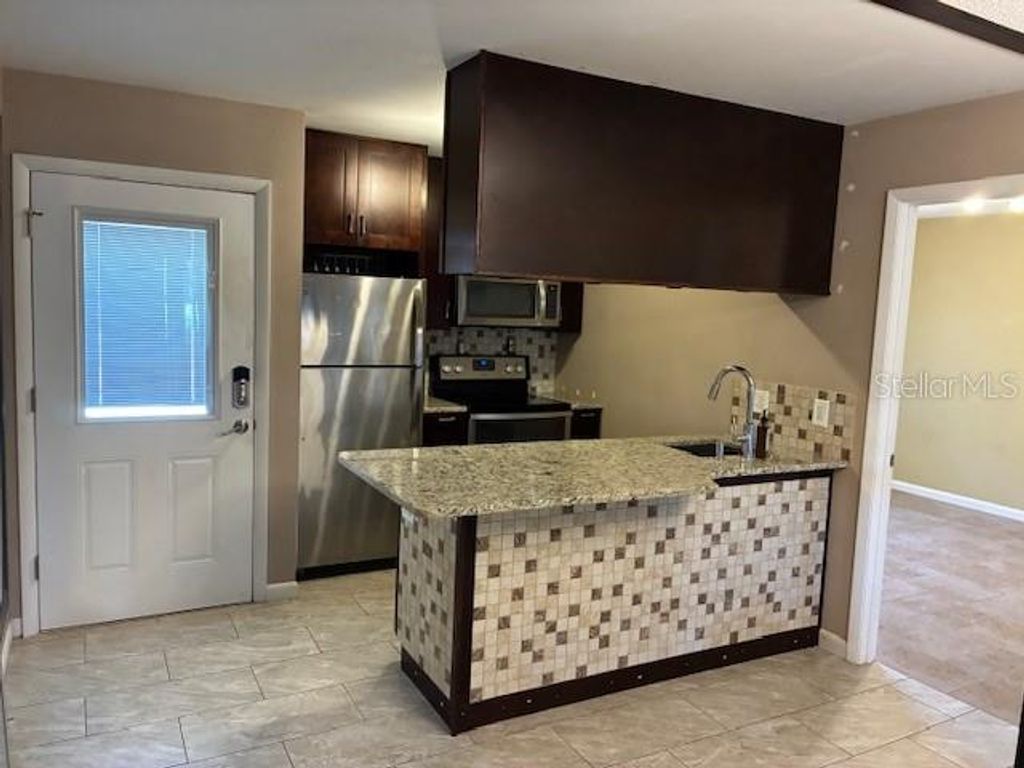 Photo of 3806 N Oak Drive #V21, Tampa, FL 33611 (MLS # A4681043)