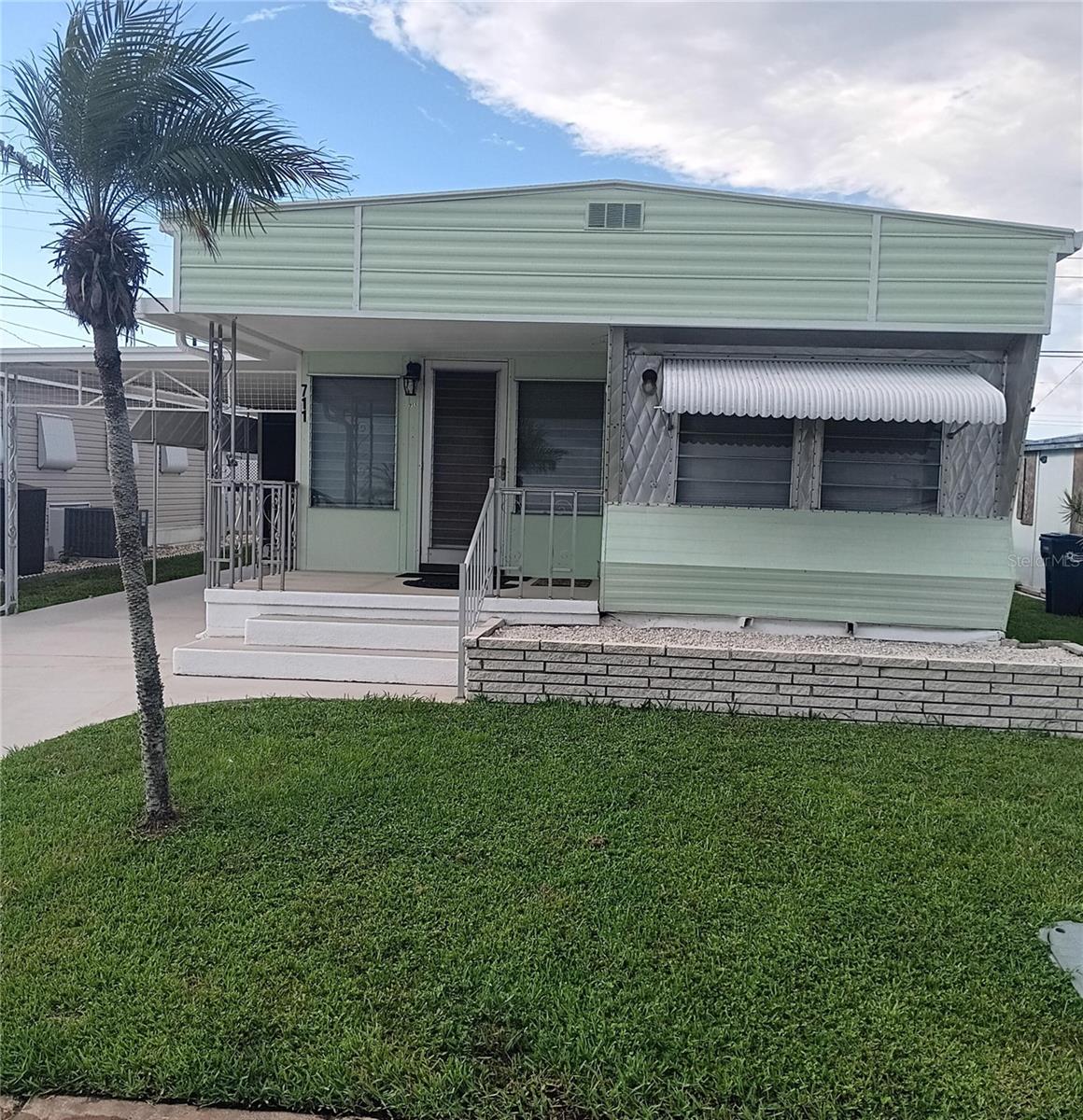 Bradenton Florida, home is newly updated and impeccably clean. You won’t have to lift a finger just bring belongings and move right in. Home is located in the Fairlane Acres community. water, sewer cost inclusive. Park has amenities featuring, swimming pool, shuffle board and pickle ball court as well as large clubhouse with many activities.Home features 2 Bedrooms, 2 bath, large kitchen with separate dining area, beautiful lania and large living room area. Ample storage with 2 storage areas attached to a 2 car carport. All newer appliances will be included: Washer, Dryer, Refrigerator and Stove. Great location with a multitude of shopping, restaurants, and entertainment nearby. You are only 6 miles from SRQ airport, 8 miles to beautiful beaches and Anna Maria Island, a quick 10 miles gets you to to downtown Sarasota.A convenient and affordable option for those seeking a relaxed Florida lifestyle.