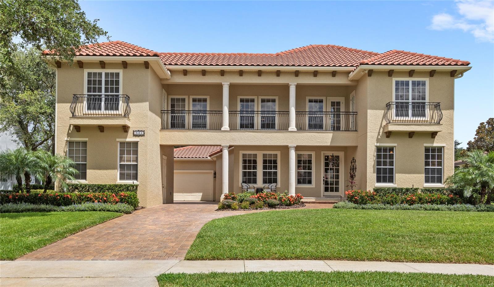 Keene’s Pointe is more than a neighborhood; it’s a lifestyle. This 24-hour attended, gated community in Windermere is home to The Golden Bear Club, a Jack Nicklaus–designed 18-hole golf course featuring resort-style amenities including tennis, fitness, swimming, and dining.
Tucked within this sought-after community, you'll find a fully renovated, move-in-ready home offering 5 bedrooms, 4 full bathrooms, and a thoughtful layout for both everyday living and entertaining. Inside, you’re welcomed by a functional drop zone, a private office with custom-built-ins, and a formal dining room with classic wainscoting.
The open-concept kitchen and great room feature soaring two-story ceilings, a gas fireplace, and beautiful built-ins, anchored by an oversized island ideal for gathering. French doors from both the great room and the spacious primary suite lead to a screened-in lanai with a summer kitchen, pool, and spa, and a large fenced backyard complete with a fire pit and mature fruit trees: orange, grapefruit, lemon, and lime.
Downstairs also includes a secondary bedroom with an adjacent full bath and a well-appointed laundry room with storage and workspace. Upstairs, a generous bonus room with built-in desks connects to two bedrooms with a shared bath, plus a separate guest suite complete with a wet bar and private balcony, ideal for visitors or multi-generational living.
Additional highlights include three garages (two attached, one detached and air-conditioned), a Navien tankless water heater, and countless upgrades: custom closets, exterior and interior paint, pool/spa enhancements, updated drain field, professional landscaping and lighting, and more.
Zoned for top-rated public and private schools and conveniently located near shopping, dining, major roadways, and Central Florida’s top attractions.