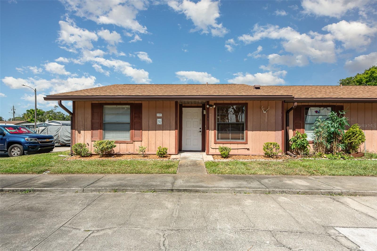 This cozy and recently remodeled 2-bedroom, 2-bath condo features quartz counters, ceramic tile in main living area and master bedroom, along with an updated and modern master shower. This location is in a quiet area located close to shopping restaurants and only minutes from the beach. The rear porch is fully enclosed and screened. This is a great investment as a second or vacation home, and your association fees cover basic cable, internet, water, and access to the community pool. The roof and HVAC are both only 5yrs old and though built in 1986, it has never flooded or experienced any storm damage. Come see it in person, easily the best value in the area!