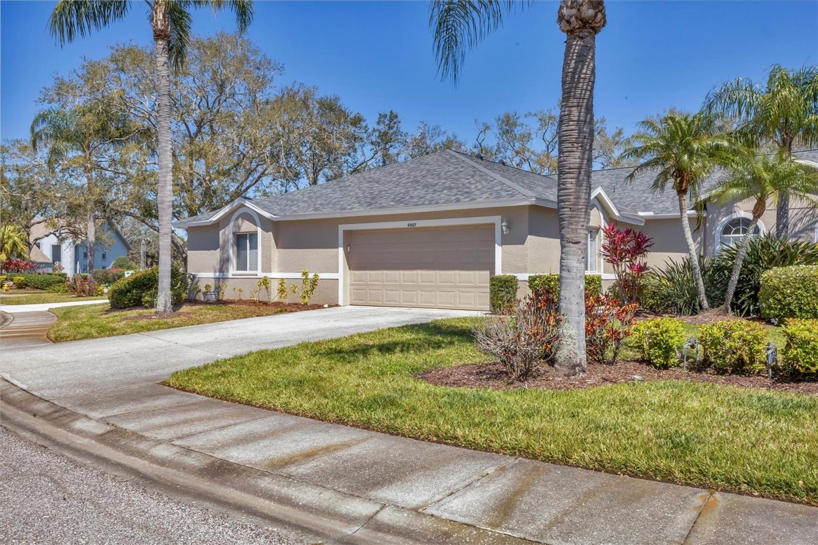 Stunning villa home in popular Tara is Florida living at its best! Welcome to this beautifully upgraded villa in the sought-after Tara community, where natural light fills every space, creating a warm and inviting atmosphere. Designed for comfort and style, this home offers two bedrooms, two baths and a den, ideal for golf lovers and those who enjoy an active lifestyle. Interior highlights include upgraded flooring with elegant porcelain and laminate floors that flow seamlessly throughout the home. Gourmet kitchen features granite countertops, upgraded Woodmark cabinets, an updated sink and faucets, plus a reverse osmosis system for fresh, clean drinking water. Boasting luxurious baths, both baths offer granite countertops, and the primary bath has been upgraded with a porcelain tile shower with a sleek see-through door. The bright and airy den has a skylight to enhance the space with additional natural light, creating a reading or workspace. Designer touches with special Hunter Douglas blinds have been installed throughout the home for style and privacy. For outdoor and community features, the lanai has been enclosed and converted into a dining area, adding even more functional living space to enjoy. A spacious two-car garage provides ample storage and convenience. Maintenance-free living allows you to spend more time enjoying all Tara has to offer. New roof (2023) ensures peace of mind for years to come. Resort-style amenities at Tara allow you to enjoy an exceptional lifestyle with the many of them included in your membership. This home conveys with a Class A equity golf membership, providing access to the driving range, putting green and well-stocked pro shop. Savor fine dining plus a casual grill room, and a convenient poolside concession stand. There is a State-of-the-Art fitness center with the latest equipment, plus a sauna and hot tub for relaxation. The resort-style pool and sports courts include a lap pool, bocce ball, pickleball and tennis courts. Social events and activities offer a vibrant calendar of events to keep residents engaged and entertained. Tara is conveniently close to the UTC Mall, downtown Sarasota, SRQ Airport and Interstate 75, and the beaches. Restaurants and shopping are all nearby. Enjoy all the culture Sarasota has to offer with the Ringling Museum, Selby Gardens and the many special theatres. This is more than just a home, it’s a lifestyle. Don’t miss this opportunity to enjoy resort-style living in Tara. All information believed to be true and accurate and should not be solely relied upon. Buyers are responsible to verify all information.
