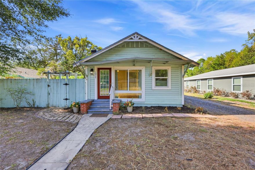 Welcome to this delightful Suncrest cottage in the popular Stephen Foster neighborhood, where charm, comfort, and convenience come together beautifully. With attractive curb appeal and a spacious interior, this home is sure to delight! One of the most inviting features is the fully enclosed front porch, now a sun-filled bonus room with expansive windows that go from ceiling to floor. Whether you envision a cheerful plant room, cozy reading retreat, or welcoming sitting area, this flexible space is sure to become a favorite. From there, a charming glass door keeps light moving through the home and leads into a spacious living room highlighted by a beautiful brick fireplace with natural gas, giving the home warmth and character. The warm wood flooring extends through much of the home, while tile in the kitchen and baths adds practicality. The primary bedroom is spacious and features an ensuite private bath with tub/shower combo generous and vanity. The second bedroom is spacious as well and has a hall/guest bath just outside the bedroom door and off the hallway so it is convenient for guests. The kitchen opens to the main living and dining areas through a pass-through, making the layout feel open and connected. It is equipped with a gas stove, Bosch dishwasher, refrigerator, double sink, and disposal. Keep going back to enter another large bonus room that can act as an office, another sun room, or just provide extra storage and pantry possibilities. The washer and dryer are conveniently tucked into the closet in this room as well. Step outside to a backyard designed for enjoying the Florida lifestyle, complete with privacy fencing, space for gardening, a paver patio with built-in fire pit, and an included storage shed. There is also a 2 car garage that would be great for storage, or even as a studio or hobby room as the opening was fitted with double doors by a previous owner. If you wanted to you could certainly have a garage door reinstalled to be able to park 2 vehicles inside. All just minutes from University of Florida, a quick commute to UF Health, The VA and the Vet School, downtown Gainesville and lots of nature parks. There is plenty of dining, shopping, and more. Just 4 minutes drive to one Publix, Aldi or Wards Grocery Store and 6 minutes to another Publix. So convenient!  Don't miss this adorable cottage.  Call today to schedule your tour!