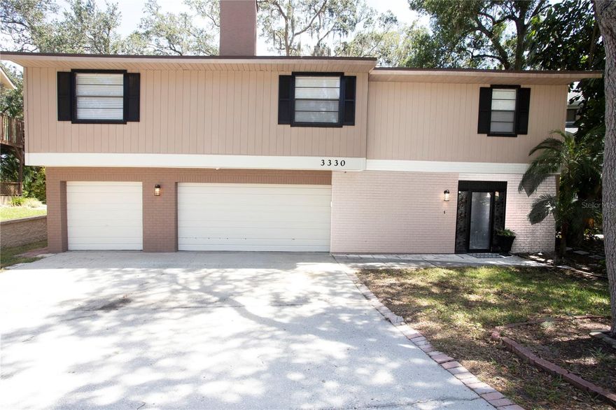 This one is priceless! Nestled at the top of the bay area, boasting over 3500 square feet of entertaining space, this home is completely remodeled and ready for you to make it yours! You will feel like every day is a vacation, enjoying your huge backyard beautifully crowned by the private conservation area along Lake Tarpon Canal. Enjoy a nice cup of coffee while viewing the sunrise on your screened-in patio or 2nd-floor balcony overlooking the beautiful canal. The downstairs area is fully air-conditioned entertainment room and extra living space that works great as an OFFICE/BONUS ROOM. The three-car garage will house your cars plus a golf cart for late night neighborhood strolls. If you have been looking for the perfect coastal property with a ton of storage, look no further! This property is all business in the front and a party in the back, so bring your boat or your camper and enjoy the indoor/outdoor Oasis. The home has been completely redone over the last year with new kitchen, new bathrooms, floors and so much more. Expand the indoor entertaining area by creating another outdoor living space on your gorgeous new deck. With access from the dining area, and impressive views of the conservation area behind your new home, this is sure to be the best seat in the house. Your own premium master suite awaits on the other side of the house complete with your own ensuite bathroom. Wake to a beautiful home with a great backyard, or hop in the car and spend a day enjoying the beaches, downtown Safety Harbor breweries, and restaurants, or any of the area’s many attractions just minutes from your new home. There’s access from the neighborhood to walk or jog the paths all along the canal. The roof was replaced in 2020. This home is completely remodeled with upgraded appliances and perfectly placed on a gorgeous piece of land.