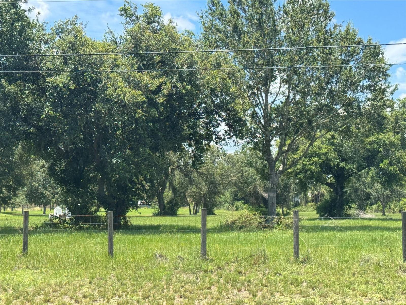 Serene 3.85-Acre Agricultural Lot with Privacy. Discover the perfect blend of tranquility and opportunity with this 3-acre agricultural lot, offering endless possibilities for farming, or building your dream estate. Nestled in a peaceful setting, with enough distance between you and the neighbor Enjoy the freedom of no HOA restrictions while still being conveniently located near essential amenities, and charming rural communities. Whether you're looking for a private retreat, an agricultural investment, or the perfect canvas for a custom home, this property is ready to bring your vision to life. Features: - 3+ acres of prime agricultural land - canal near the rear for added privacy & scenic views - Ideal for Private lifestyle living - Plenty of space for a custom home, or barn - No HOA flexibility to use the land zoning of AG - Easy access to nearby highways, shopping, and dining Seize this rare opportunity to own a private, nature-filled escape with endless potential. Call today for more details or to schedule a tour!