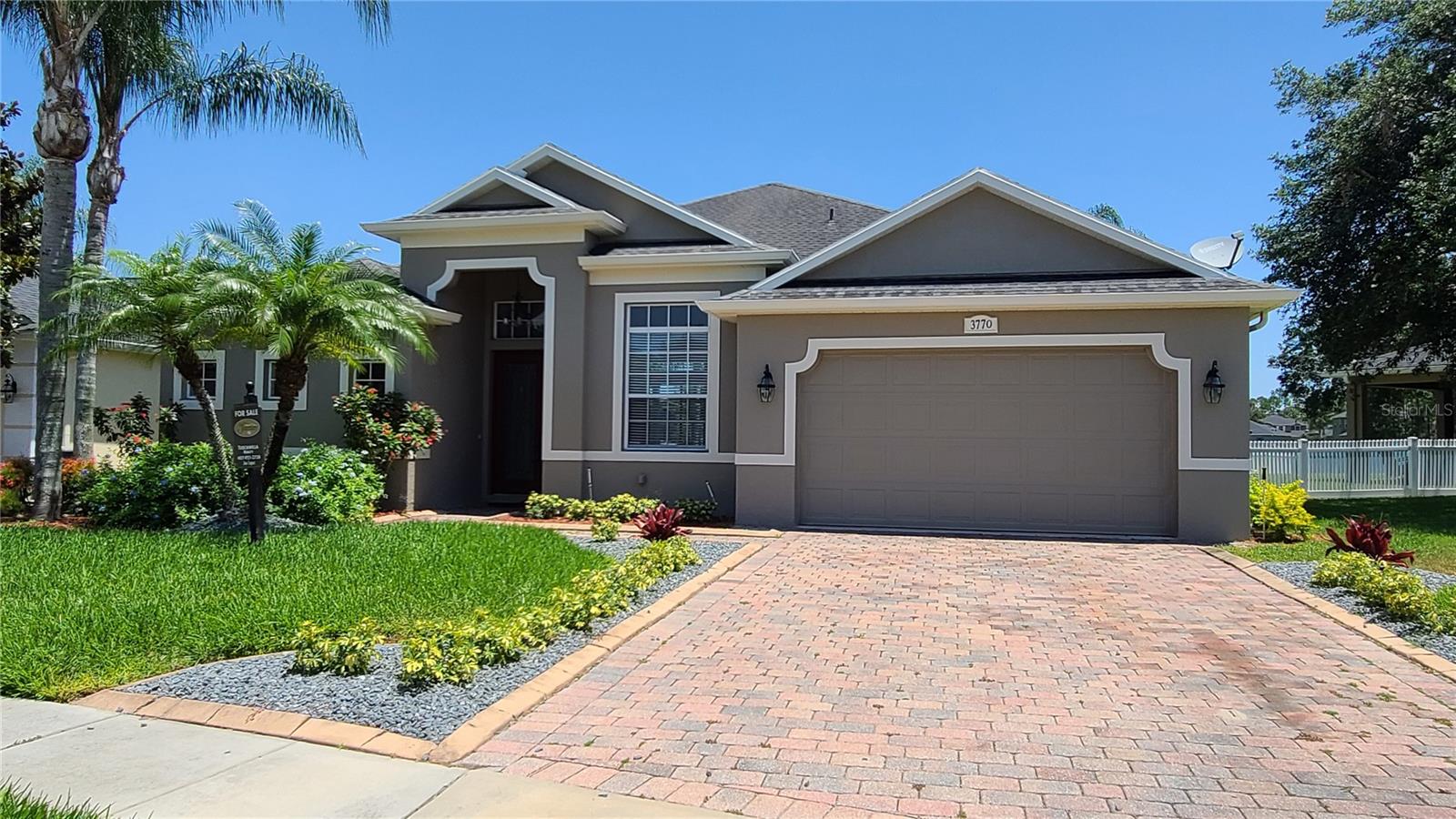Amazing opportunity to rent in the highly sought after Oviedo neighborhood, The Sanctuary! This Gorgeous 3 bed, 3-1/2 baths, plus a den/office, one story home, is located on a quiet cul-de-sac with an amazing view of the pond in the back. Beautiful kitchen with granite counter tops, plus bar stool sitting area and open to the family room and dinette. New stainless steel refrigerator. Freshly painted inside with neutral/modern grey tone paint colors, main living area and master bedroom have lighter wood looking laminate flooring, plus ceramic tile in family, dining, kitchen, bath and den, plus new carpet in bedrooms. Large master suite with nice walk in closet, master bath has an amazing garden tub with separate shower, plus granite counter with elegant bowl sinks. A very spacious floor plan with split bedrooms and a guest half bathroom, plus separate formal dining. Sliding doors off the living room lead out to the nice size fenced back yard, a covered porch area with pavers extended for enjoying no rear neighbors and a gorgeous pond view with conservation behind. This home comes equipped with an inside laundry room and utility sink in the garage. You can find a resort style club house featuring the community pool, splash pad, fitness center, tennis, soccer, basketball, Volley ball and playground. Zoning is top rated for schools. Conveniently located close to, 417 and UCF, close to shopping, Oviedo Mall and the new Oviedo on the Park. Equal Housing Opportunity