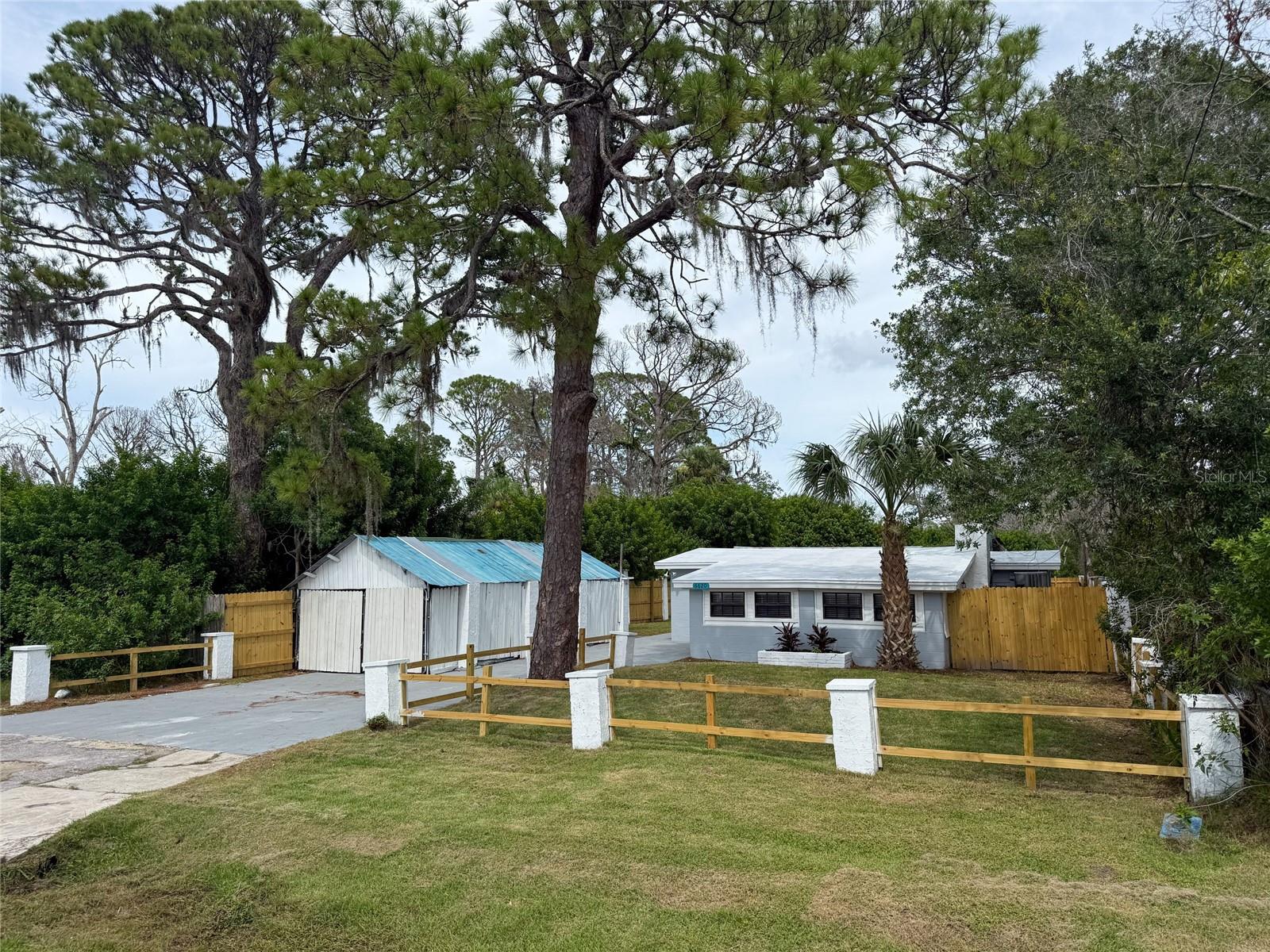 This is a very unique property. If you want a fully renovated 3 bedroom, 2 bath home that is roughly 1,338 sq ft with MOL a quarter acre of privacy that is fenced in by a 6 foot privacy fence, this is the one for you! This home boasts tons of recent updates. New paint inside and out. Brand new vinyl luxury plank and wood look tile for easy maintenance. Brand new solid wood (not cheap particle board) kitchen cabinets with quartz countertops featuring a breakfast bar and 4x12 subway tile for the backsplash. You will also appreciate the brand new 4 piece stainless steel appliances. You will find new ceiling fans, new 6 panel doors, new contemporary lighting and hardware throughout the property. The primary bedroom has recessed lighting, a walk-in closet and new everything in the bathroom. The common bathroom has also been completely refreshed. Not only do you have a large 20x12 living room, you also have a roughly 12x12 family room that boasts a fireplace. To make laundry easy, you have inside laundry so you don't have to sweat it out in a garage doing laundry and this is where your new hot water heater is located. Outside is just as special as inside. The backyard is fenced in with brand new 6 foot privacy fence to help create your own personal oasis in this extra large back yard. You then have tons of options with the roughly 50'x10' covered deck that can be used for endless scenarios. Just hang out in the shade while enjoying the backyard to yourself or invite 20 of your closest friends over and still have plenty of room to roam. Other options are to enclose a portion of the covered deck to create a little mancave/shop and still have plenty of space to entertain a ton of friends on the rest of the covered deck! The potential here is endless. You also have a metal enclosed garage to the left of the property to keep you vehicle or toys shielded from the weather. During the renovation, the renovation was done with FEMA flood damage resistant materials such as Densglass which is a replacement for drywall (I bet you can't tell the difference) and closed cell insulation over the block walls. These materials are considered mold resistant with DensGlass having the highest level of performance for mold resistance under the ASTM D3273 test method with a rating of 10. So schedule your showing today if you are tired of the cookie cutter development homes! Buyer to verify room sizes.