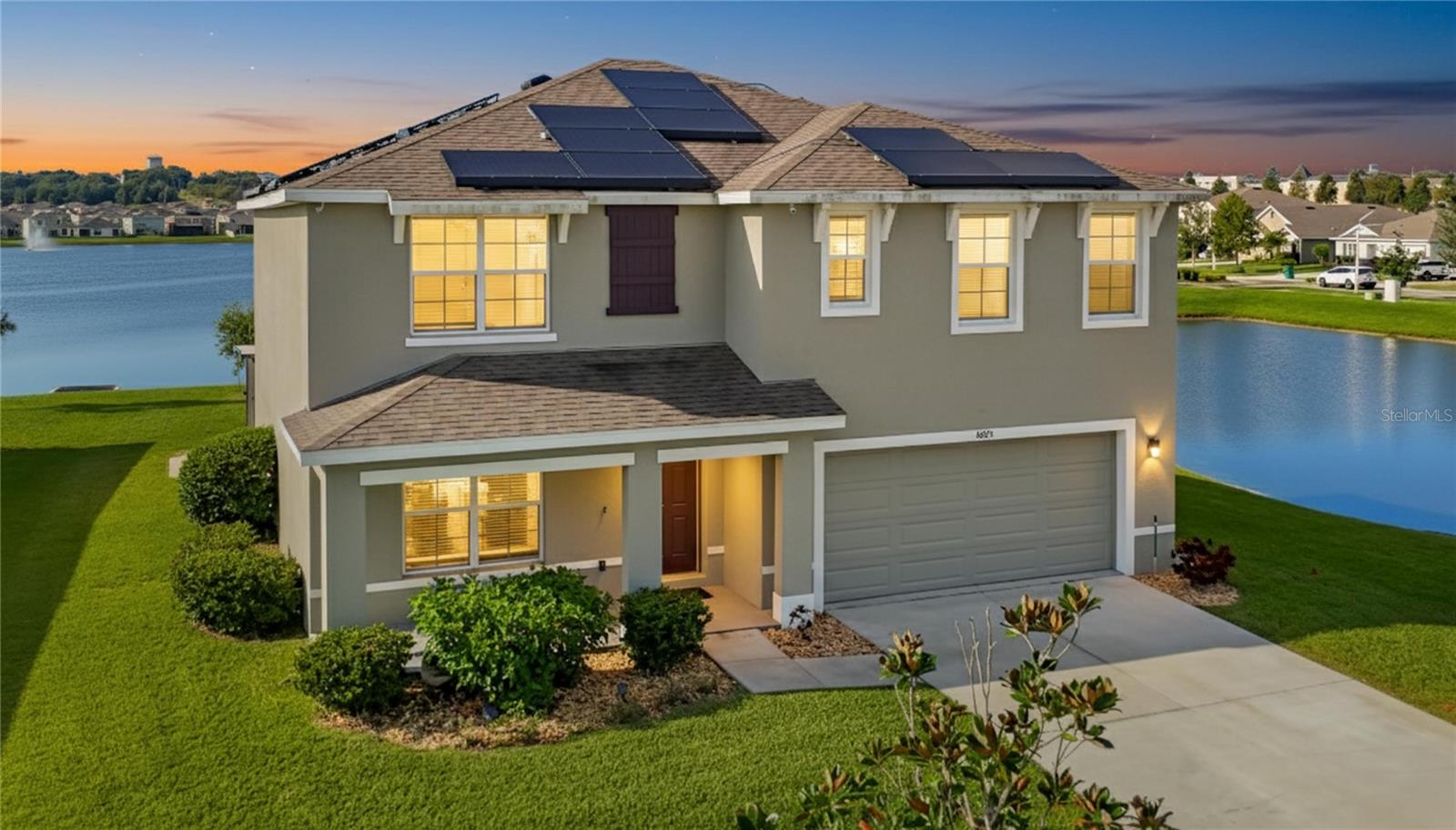 WHY WAIT FOR NEW CONSTRUCTION...This 5 Bedroom 3 Bathroom 2-Car Garage 2,605 sq ft 2 story home awaits you.  INCLUDING A SPECTACULAR WATERVIEW.  This D.R.Horton's Hayden model, being one of the largest lots, is only 4 years young.  Waterview wraps around with no neighbors too close on either side.  MOVE-IN READY.  Open-floor plan with a study/den downstairs, and an extra bonus room upstairs.  Breakfast bar in kitchen with extra space for eating, and a formal dining space. Mother-of-Pearl backsplash in kitchen with a designated coffee/tea area, and dual sinks. Stainless Steel appliances.  Lots of natural light coming in from large windows, sliding doors.  Spectacular waterview of the prime location of this home, along with an oversized screened Lanai.  Lots of storage both upstairs and downstairs.  Master has 2 walk-in closets, walk-in shower, separate water closet, and dual sinks.  2nd bathroom upstairs has dual sinks with shower and tub.  Full bathroom downstairs with another bedroom. Transferable leased Solar Panels reducing electric costs. Community features include a resort-style pool, open-air clubhouse, Playground and Dog Park. Set in vibrant Zephyrhills and only a few miles from Tampa, this location offers a mixture of nature, adventure, local culture, and convenience:  Outdoor & Family Fun like the Skydive City which offers top-tier skydiving and solo jumps, plus a lively scene with food and atmosphere.  Zephyr Park & Waterplay, that hosts a scenic 34-acre park with tennis courts, walking paths, picnic spaces, playground, and a free 7,000 sq ft splash pad. Hillsborough River State Park, with 7+ miles of hiking trails, canoe and kayak rentals, camping and riverside exploration. Upper Hillsborough Wildlife Management Area which is great for hiking, biking, horseback riding, and wildlife spotting in a serene preserve. AND THERE'S MORE, with the Krusen Park with an a 30-acre space featuring basketball, soccer, inline hockey, playgrounds, picnic areas! An added treat only 10 miles away is Epperson Lagoon. Local Culture & Community Vibes include Zephyrhills Brewing Company, Zephyrhills Museum of Military History. Historic Downtown Zephyrhills—charming district with early 20th-century architecture, unique boutiques, murals, cafes, and a warm small-town ambiance. Zephyrhills Depot Museum—located in a restored 1927 rail depot, it highlights the city's railroad heritage. Farmers Market & Unusual Local Finds—enjoy fresh produce, artisan goods, and playful attractions like the “Chickens of Zephyrhills” photo hunt around town. Convenient to Hospitals and Medical Centers, Shopping & Dining to nearby Wesley Chapel. Destinations like The Shops at Wiregrass, The Grove, and Tampa Premium Outlets for additional shopping, dining, and entertainment. Easy access to Busch Gardens & ZooTampa, both under 30 miles away for theme park and family fun days.  So many activities to enjoy on the weekends.   Your Dream Home Awaits You.  Make your appointment today.