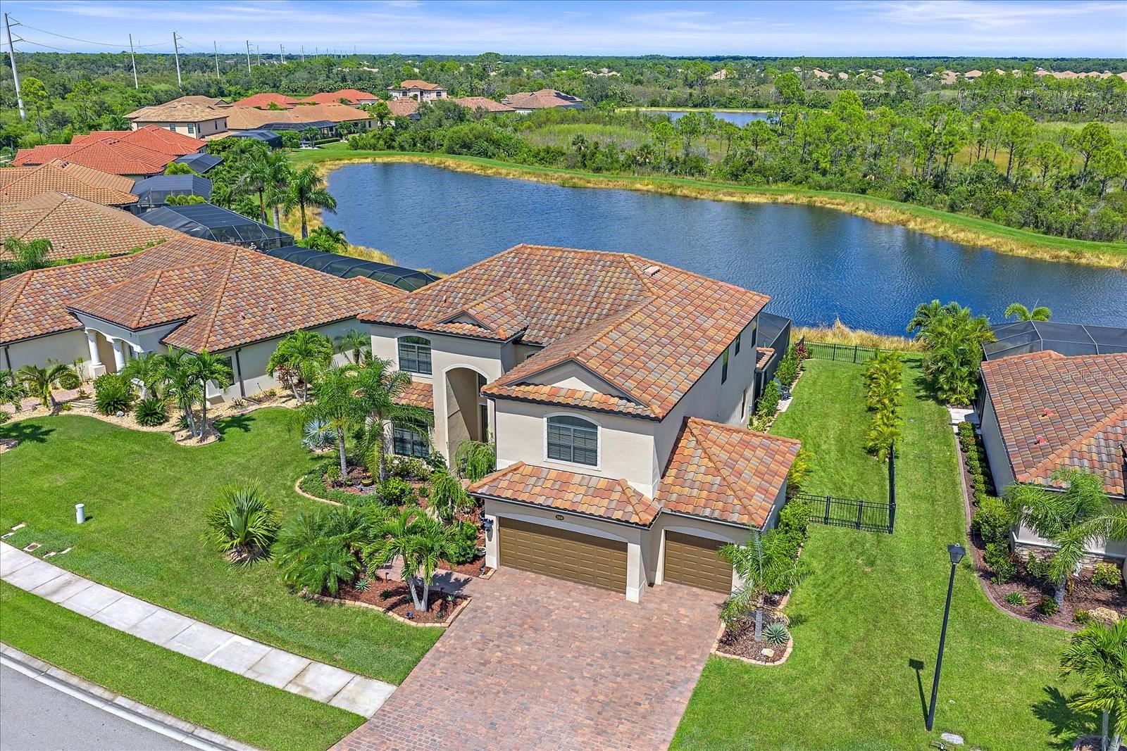 Impressive 6-bedroom, 3-bath, 3-car garage home located in the highly desirable, gated community of Gran Paradiso at Wellen Park. This beautifully upgraded residence offers 3,563 sq. ft. of living space with a thoughtful floor plan perfect for entertaining, working from home, or accommodating multi-generational living. The property features a brand-new heated saltwater pool with full enclosure and expanded patio (2023), creating a private outdoor oasis with serene lake views.
Step inside to find 9 ½ ft. ceilings, an open foyer, and a bright, open-concept layout that enhances the sense of space and natural light. The interior is finished with ceramic tile and luxury vinyl flooring, while the garage showcases durable epoxy flooring. The garage is climate controlled with a mini split. The upgraded kitchen is a chef’s delight with stainless-steel appliances, abundant cabinetry, and a large island for gathering. Offered fully furnished (optional), this home provides a true turnkey opportunity for immediate enjoyment.
Gran Paradiso delivers resort-style living with an impressive amenity package including a grand clubhouse, state-of-the-art fitness center, tennis and pickleball courts, resort-style pool, spa, and miles of walking and biking trails. HOA fees include lawn care, high-speed internet, and cable, allowing for a low-maintenance lifestyle. Conveniently located just minutes to Wellen Park, historic downtown Venice, championship golf, shopping, dining, and the pristine Gulf beaches.
This is a rare opportunity to own a move-in ready, beautifully appointed home with modern upgrades and a brand-new pool retreat in one of Venice’s most desirable communities. Schedule your private showing today and experience all that Gran Paradiso has to offer.
