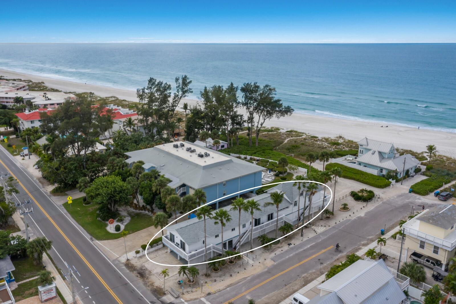 Located adjacent to the sparkling gulf waters this inviting triplex is a great investment opportunity for those seeking both charm and versatility, offering a diverse array of units: a 3BD/2BA, a 2BD/2BA, and a 2BD/1BA, each offering unique and comfortable living spaces. The property has been recently enhanced with the addition of a hot tub and a swim spa, each set within their own private, fenced areas, offering residents or guests a secluded spot for relaxation. Full furnished and ready for occupancy, it is perfectly set up for use as a vacation rental, long-terms tenants and or a primary home. The 3BD/2BA unit offers vaulted ceilings and floor to ceiling windows creating a picture perfect setting from the gorgeous gulf views. This unit is ideal as a primary home while allowing for income from the additional two units. Just steps to the beach. You must see to appreciate this great investment on Anna Maria Island.