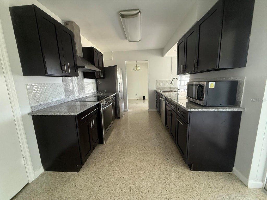 Photo of 1750 Great Brikhill Road, Clearwater, FL 33755 (MLS # O6443490)