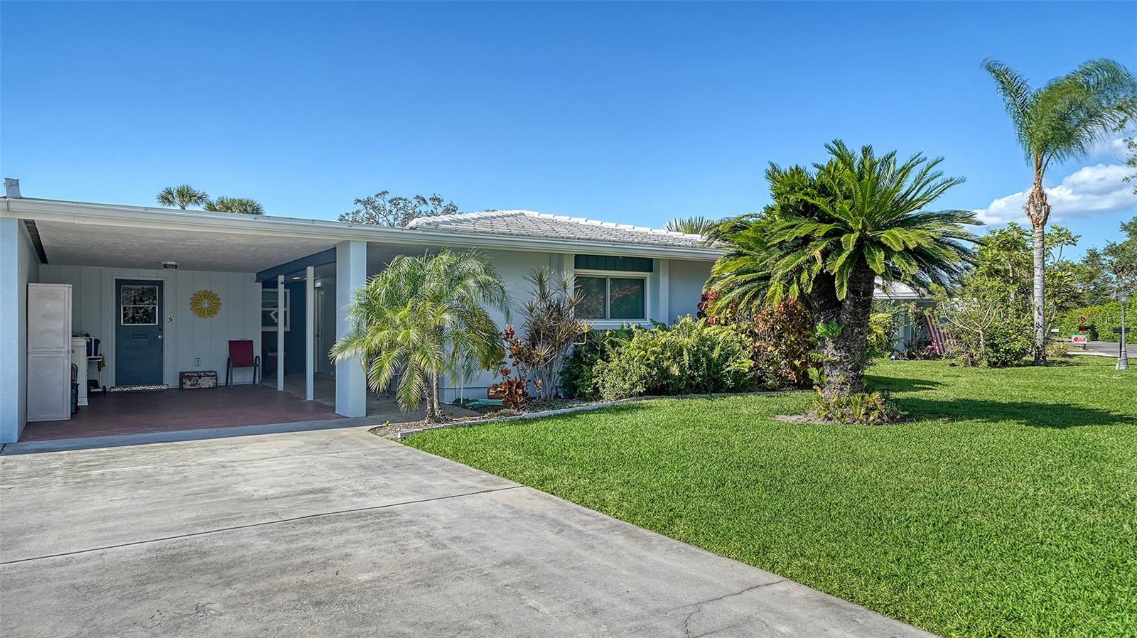 Welcome to this beautifully maintained 2 Bedroom, 2 Bath villa in the quaint 55+ community of Village Green in the heart of Sarasota! As you step inside, you are greeted by a warm and inviting ambiance, and a very spacious layout. The Living spaces are thoughtfully designed and boast ample room for relaxation. You will enjoy entertaining in the Living room/Dining room combo along with a huge Family room/Flex space overlooking a beautiful community landscaped area! The kitchen has modern amenities such as stainless-steel appliances, quartz countertops and convenient access to an eat in breakfast area. The Primary suite is oversized and consists of an updated ensuite with walk-in shower. The secondary bedroom is spacious, perfect for guests or a den, along with plenty of storage and easy access to the updated secondary bathroom. The Laundry room is off the kitchen and includes a sink and built in storage. The carport is ideal to keep your car protected and has a work bench and more storage! The Village Green community offers maintenance-free living including community pool, and beautifully landscaped surroundings. This community is centrally located to Sarasota’s quaint shops, fine dining and entertainment. UTC Mall, Yoder's, Der Dutchman and the Legacy Trail are all nearby. Short drive to Sarasota Airport and major highways. Schedule your viewing today and experience the possibilities firsthand!