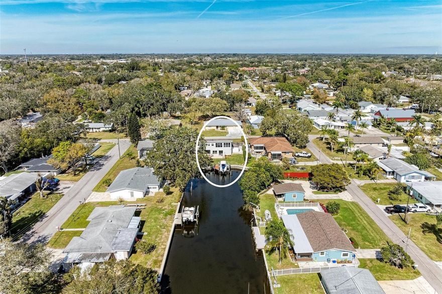 AMAZING LOCATION!!! Wake up to shimmering WATER VIEWS, step onto your private dock, and be cruising toward the Gulf within minutes—this is the waterfront lifestyle buyers dream about.

Impeccably maintained and completely move-in ready, this exceptional RIVERFRONT  home offers an RARE opportunity to own a private slice of paradise on the coveted north side of the Manatee River. Combining luxury, freedom, and effortless access to everything the Gulf Coast has to offer, this is more than a home—it’s an EXPERIENCE!!!!! 

Tucked away at the end of a quiet, deep-water canal, you’ll enjoy unmatched privacy, wide-open WATER VIEWS, and breathtaking sunsets that never get old. Whether you’re entertaining guests or unwinding after a day on the water, every space is designed to make the most of this incredible setting.

For boating enthusiasts, this property is a standout. A PRIVATE DOCK, raised concrete seawall, and 10,000-pound motorized boat lift provide quick, easy access to open water—no hassle, no waiting, just go. From your backyard, reach waterfront dining, sandbars, and the Gulf in as little as 15–30 minutes.

Inside, the home strikes the perfect balance between comfort and sophistication. The spacious layout features three bedrooms and three bathrooms, including two large primary suites—one on each level—ideal for hosting guests or creating a private retreat. Multiple living areas, a dedicated media room, and a covered lanai offer plenty of space to relax, entertain, and enjoy the view.

The kitchen is both beautiful and functional, featuring KraftMaid cabinetry with custom pullouts, granite countertops, and a conveniently located laundry and pantry area. Porcelain tile floors on the main level and rich oak hardwoods upstairs add warmth and style, while large double-pane windows flood the home with natural light. A dual-zone A/C system ensures comfort year-round.

Step outside and the lifestyle continues. With direct access from the lower bedrooms to the backyard, plenty of room to entertain, and dedicated boat/RV storage with a 30-amp hookup, this property is built for how you actually want to live.

And perhaps most importantly—there are no HOA, CDD, or deed restrictions. Use it as your full-time residence, your weekend escape, or capitalize on its strong income potential as a vacation rental.

Opportunities like this—private, waterfront, and truly boat-ready—don’t come around often. If you’ve been waiting for the right one, THIS IS IT !!!! CALL TODAY TO SCHEDULE AN APPOINTMENT.
