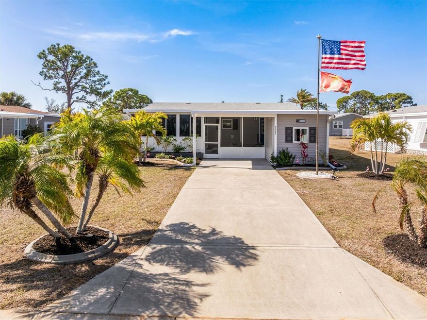 Located on a quiet circle in a 55+ community with low HOA fees of just $125/year and in an X flood zone, this well-kept 2 bedroom, 2 bathroom home offers relaxed coastal Florida living near Amberjack Environmental Park where traffic stays minimal. Mature palms and aluminum Bahama shutters create inviting curb appeal, and a covered carport adds everyday convenience.

Inside features luxury vinyl plank flooring throughout, updated quartz countertops, stainless steel appliances, and an open living area with breakfast bar. A stackable washer and dryer are included. The primary suite offers a walk-in closet and private bath with walk-in shower, while the guest bedroom has two closets, one with a built-in safe, beside a full tub/shower bath.

Two lanais extend the living space — one enclosed with removable windows and another screened, perfect for enjoying a quiet morning coffee or reading the paper in the coastal breeze. The attached storage shed has power and works perfectly for projects, hobbies, or extra gear.

Just minutes to Manasota Key and a short trip to Don Pedro Island and Boca Grande for fishing, paddling, shelling, and birding — ideal for seasonal or year-round coastal living.