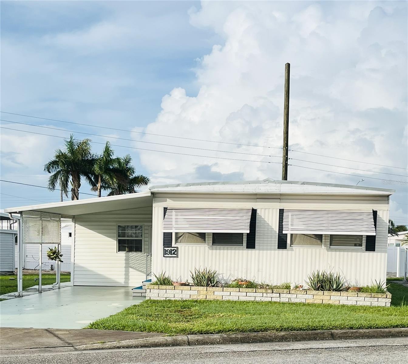 Spacious Lot-and-a-Half | 2BR, 1.5BA with Florida Room & Recent Updates
Set on a desirable lot and a half, this well-loved 2 bedroom, 1.5 bath home offers plenty of room inside and out. The open living and dining area creates an easy, comfortable flow, while the spacious Florida Room—complete with a pull-out for guests—adds even more flexible living space. A laundry closet in the Florida Room adds convenience right where you need it.
The primary bedroom and guest bedroom are well-sized, and the home’s carport provides covered parking with extra outdoor space. Recent 2024 updates include a new roof, new air conditioner, and new refrigerator, giving you peace of mind for years to come. Currently tenant-occupied, this property could be an attractive investment opportunity or a welcoming full-time or seasonal home.
Located in Trailer Estates, a Special Park and Recreation District governed under Chapter 418, Florida Statutes, residents own their land—no lot rent, CDD, or HOA fees. The annual park tax covers cable, high-speed internet, trash pickup, fire and rescue services, and access to outstanding amenities including a marina with rentable boat slips, private beach, pool, hot tub, fitness center, shuffleboard, bocce ball, pickleball, woodshop, and nearly 60 active clubs and social events. Experience one of Sarasota Bay’s most vibrant and welcoming 55+ communities.