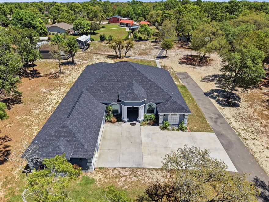 Stunning 2023 custom home by Dream Custom Homes situated on 1.54 acres, offering 4 bedrooms plus a dedicated office, 4 bathrooms, and modern upgrades throughout. This move-in ready home combines the privacy of agricultural zoning with the convenience of being close to shopping, dining, and just 45 minutes to Tampa.

Step inside to a spacious open-concept floor plan designed for both everyday living and entertaining. The kitchen features beautiful granite countertops, ample cabinetry, and flows seamlessly into the main living areas. A dedicated office provides the perfect work-from-home space or flex room. Home is fully wired for WIFI. 

Enjoy Florida living at its best with an extended paver lanai, ideal for relaxing or hosting guests. The property also includes a large 20x16 ft shed, perfect for storage, a workshop, or hobby space. Fully fenced.

This home was built with both quality and future planning in mind, featuring underground electrical service (no overhead wires), a 200-amp electrical panel prewired for a future pool, and newer construction for energy efficiency and peace of mind.

A rare find, the entire home is fully wheelchair accessible, offering comfort and functionality for a wide range of buyers.

If you're searching for a newer construction home on acreage, a custom home with land, or a 4 bedroom home with office near Tampa--this property checks all the boxes. Schedule your private showing today.