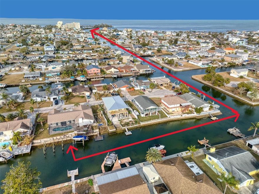 Stop scrolling- THIS IS IT! This GORGEOUS - MOVE IN READY home checks all the boxes with a SPLIT 3-bedroom, 2-bathroom plan, DIRECT GULF ACCESS on a DOUBLE LOT with an INGROUND POOL and a new BOATLIFT - it's everything you want for Florida waterfront living! With more than 2,400 sq ft of living space and 120' ft of seawall, this home is ready for summertime fun! Step inside to a bright, open floor with tile flooring throughout and a BEATUTIFUL NEW KITCHEN featuring a large island with GRANITE countertops and STAINLESS-STEEL appliances. It's a chefs dream and the perfect space to entertain. The family room or formal dining room has a cozy fireplace and sliders that open to the screened in lanai and pool area. The spacious primary suite easily fits king size furniture, has a walk-in closet and a full bathroom with walk in shower and a soaking tub with a pocket door that leads out to a covered patio for morning coffee and the pool area. You will love the oversized laundry room with extra storage and a bonus large walk-in pantry. On the other side of the home, you'll find 2 bedrooms and a hall bath - one that has access to the pool area for your overnight guests to enjoy. Step out back to your private pool and backyard oasis with water views and a peaceful over the water deck where you can watch for dolphins and manatees. Or relax by the fire pit and enjoy the salt air and sea breeze. The new boatlift (2024) can accommodate 10,000-pounds and there are other poles already in place to add a 2nd boatlift, jet ski lift or even a tiki hut. This is the perfect outdoor entertaining space. There is a 2-car garage and extra room on the side of the house so you can park your boat trailer, jet skis or RV right on sight! This is an EXCEPTIONAL property with 120' feet of seawall that sits high and dry compared to other lots in the neighborhood! All the work has been done, so you can relax and enjoy all the Gulf life FISHING, SWIMMING AND BOATING. Hudson Beach is a charming waterfront community just north of Clearwater and Tampa with NO HOA! Take your Golf Cart up to the small public beach and enjoy several waterfront restaurants and tiki bars as well as 2 convenience stores and the ice cream parlor. Conveniently located off Hwy 19 with shopping and hospital nearby and just 15 minutes to the expressway for easy access to Tampa and all major airports. This home truly has it all and is a must-see! Call me to schedule a showing today!