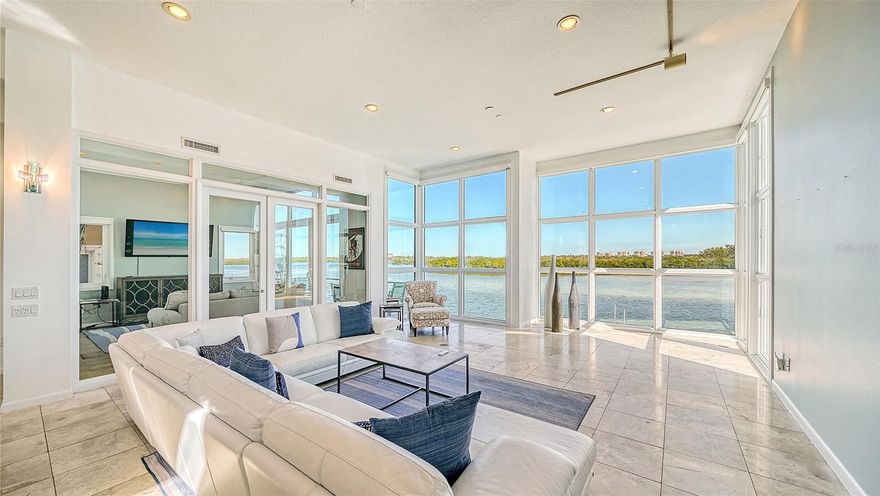 Welcome to this exquisite waterfront residence in Siesta Key, Florida, boasting an unparalleled sense of spaciousness with captivating Bay views. Combining the elegance of a luxury penthouse with the convenience of a lock-and-leave condominium, this remarkable home offers a truly unique living experience without the limitations of a Homeowners’ Association (HOA). At three stories tall, with floor-to-ceiling-windows facing Sarasota Bay, this stunning residence truly lives like a beautifully appointed townhome – long on luxury touches yet short on yard and lawn maintenance. The second-floor living area overlooks a quiet stretch of Sarasota Bay with an open floor plan offering two separate living areas and opening onto a balcony that looks out across your private pool and dock to the Bay waters. The modern chef’s kitchen is lined with bespoke custom cabinetry from Village Woodworking, with a Subzero refrigerator and Dacor range and ovens. The third level boasts a light-filled master bedroom with endless views and spacious master bath as well as a guest bedroom with views to match. The entire home is accessible via an elevator, but should you wish, the first floor has been converted into a second master suite that opens directly onto the pool deck. Keep it “as is” or redesign the first-floor living space however you wish. The outdoor living space is truly a water-lover and boater’s paradise, featuring a swimming pool and private boat dock stretching out into the Bay. The seawall is new and the dock itself is equipped with a 13,000 lb. lift; able to accommodate up to a 30 ft boat. In addition to the seawall and dock, recent improvements to the property include impact resistant windows and doors, new HVAC, roof and more. This home is a must-see for anyone seeking the exclusive lifestyle reserved for the lucky few who can live alongside our brilliant South Florida waterways.