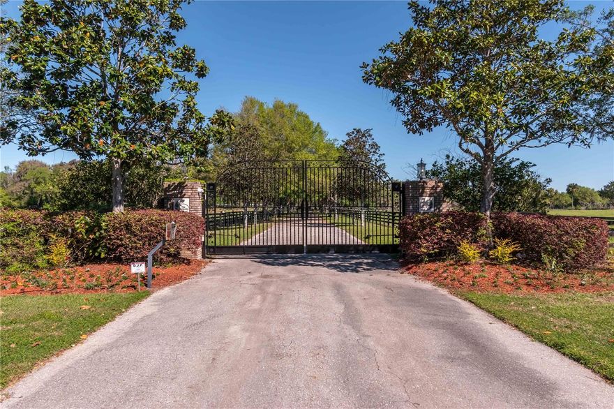 Welcome to a breathtaking equestrian sanctuary – a turn-key horse farm set on 150 rolling acres of pure paradise, just 25 minutes from the World Equestrian Center, and moments from both Ocala and Gainesville. Perfectly positioned only 5 minutes from the historic Ocala Jockey Club, this estate sits at the epicenter of Florida’s equestrian renaissance. This property offers not just a premier location—but a front-row seat to the future of elite equestrian living. Whether you're a competitive rider, investor, or passionate horse enthusiast, the potential for long-term value, enhanced amenities, and an unmatched lifestyle makes this a truly rare opportunity.
As you pass through the stately electric gate, a beautifully paved, tree-lined driveway leads you into the heart of this magnificent estate. Here, every detail is crafted for both form and function. The farm features 7 expansive paddocks, each outfitted with automatic waterers, ensuring your horses' comfort year-round. Across three dedicated paddocks, you'll find 26 sorting pens—ideal for cattle operations or multi-discipline training setups—while an impressive 80' x 160' arena, wrapped in pristine PVC fencing, offers the perfect space for practice, competition, or leisure riding.
At the center of the equine amenities stands a thoughtfully designed center-aisle, 7-stall barn, complete with an air-conditioned tack room, wash racks, and secure, fenced pastures—all blending convenience, luxury, and efficiency in one turn-key package.
Perched upon the rolling hills of horse country, the one-of-a-kind modern Victorian-inspired custom estate spans 4809 sqft. This meticulously designed home features a 50-year luxury laminate shingles roofing, ensuring both durability and timeless elegance. The interior is adorned with attention to detail and upgrades, offering four en-suite bedrooms, two additional half-baths, a built-in office, a bonus room, and a two-car garage converted into a gym with seamless epoxy flooring and a newly installed AC.
A transom front door welcomes you into the two-story foyer and grand staircase, leading to a private retreat in the form of the Master Suite. This sanctuary boasts spectacular views, a fireplace, a sitting area, and double French doors opening to a serene lanai overlooking the lush green backyard. The Master Suite also includes a spacious walk-in closet with its own washer/dryer and a spa-like bathroom.

Recent renovations add to the allure of this estate, including a fountain/aeration system in the front pond, new fencing, and a large raised garden. Approximately 80 acres of the property are adorned with pine trees, poised for harvest in the future years.

This property is not only a haven for horse enthusiasts but caters to the needs of cattle ranchers and individuals of various equestrian disciplines. The farm combines a convenient location, a private setting, exquisite design, and southern charm, making it stand out from other properties in the area. This is a once-in-a-lifetime opportunity to own a truly amazing turn-key farm – an idyllic blend of luxury and functionality, perfectly tailored to satisfy all your equestrian needs. Don't miss the chance to make this extraordinary estate your own.