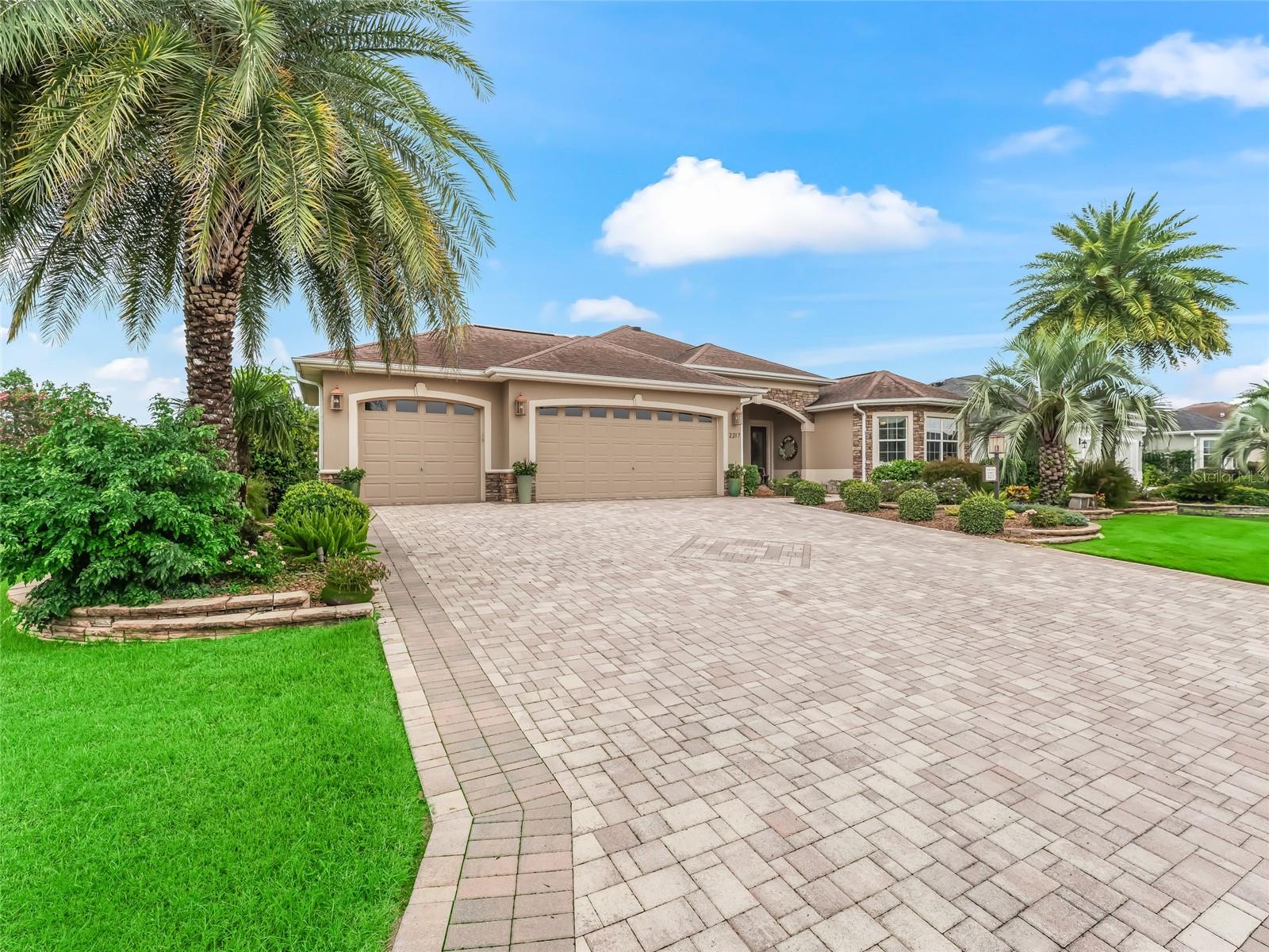 Located in the desirable Villages of Pinellas, this beautiful Premier Williamsburg home has 2683 square feet. Step into luxury at its best from the moment you enter this indoor/outdoor entertainer's paradise with spacious rooms and crown molding throughout. The kitchen includes a breakfast nook, granite countertops, beautiful wood cabinets with numerous rollouts, and an instant hot water faucet. The primary bedroom is oversized with tray ceilings. The dining room, living room, and enclosed lanai with remote control blinds and mini bar with ice maker are an entertainer's dream. There is room for a pool outside the very large, screened patio. There is a Home Warranty Choice Warranty that is transferrable and good until May 2030. YOU won't want to miss this gorgeous home!