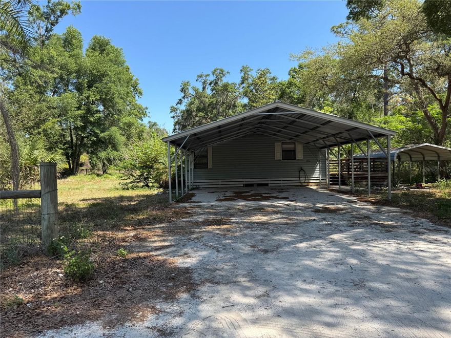 Short Sale. Short Sale. Country Retreat on Almost 1 Acre! Spacious 3-bedroom, 2-bath home with 1,404 SQFT of living space and a split floor plan. Features include an updated kitchen, 2013 metal roof, 2021 water heater, and 2019 well. Enjoy a 24x24 screened-in room with an attached workshop, fenced yard, and two separate carports. Home offers great potential with a bit of TLC—ideal for buyers looking for value and space.