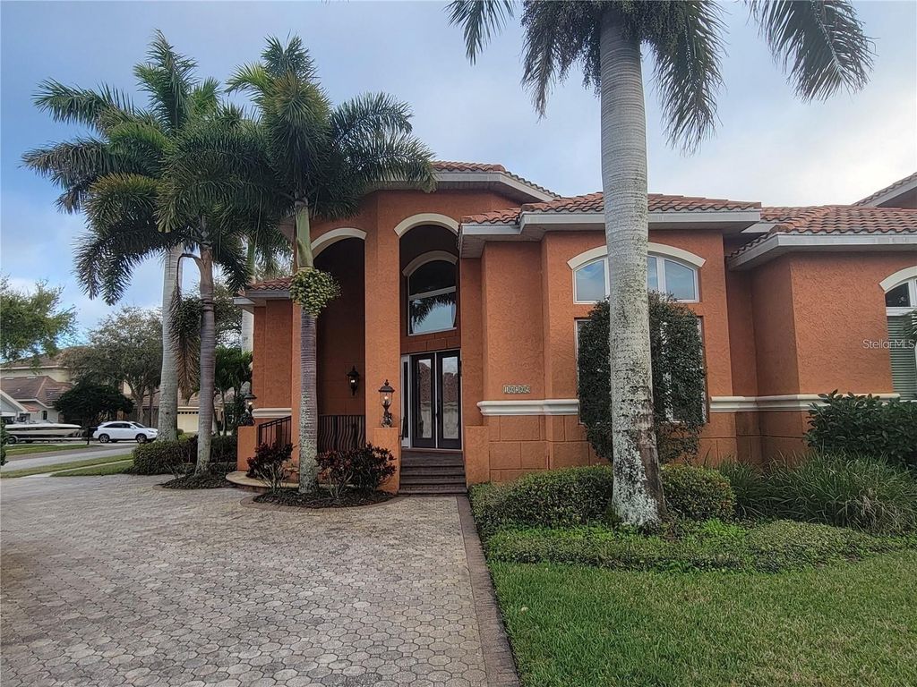 Photo of 10209 Thurston Groves Boulevard, Largo, FL 33778 (MLS # TB8473687)