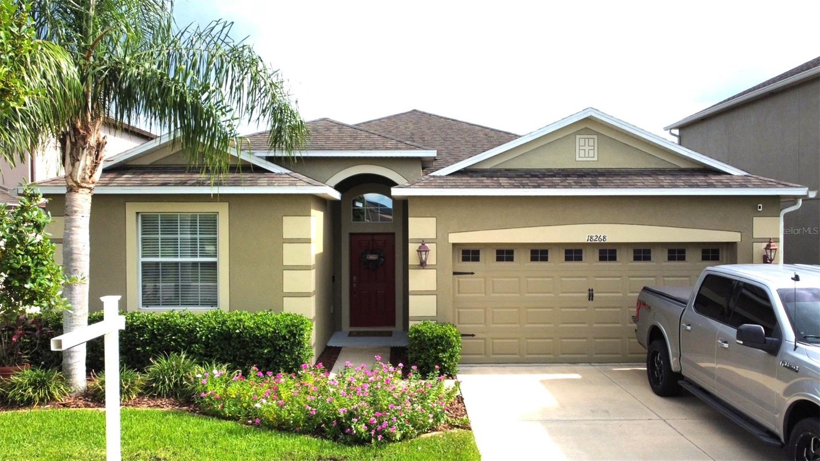 Home is located in a well established Community of Concord Station in the Heart of Pasco County. Home features stainless steel Appliances, 2" Blinds, Granite in the Kitchen, Maple Cabinetry, Rounded Corners, Full Irrigation System, Gutters and State of the Art Digital Entry System; Also, Pest Tubes in Exterior Walls!! The Hamilton is an outstanding split bedroom plan with 4 bedrooms 3 baths and a very open design with BEAUTIFUL REAL HARD WOOD IN MAIN LIVING AREAS!! Wood looking tile in all bedrooms and front entry. Experience Mature Landscaping and Private Amenity Center with over 5,000 sf usable space INCLUDING a Jr. Olympic Size Pool, Playground, Basketball/Tennis Courts, Full Fitness Center, a splash fountain and offers structured activities such as Zumba and craft time. Relax on the covered patio with a maintenance free privacy fence enclosing the beautifully landscaped yard and freshly painted exterior. AC and fridge are newer (2023). Water softener. Convenient to restaurants, shops, post office, elementary, middle, high schools, and only 2 miles from the Suncoast Parkway.