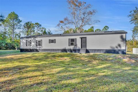 Photo of 6180 Winning Wood Trail, De Leon Springs, FL 32130 (MLS # V4946074)