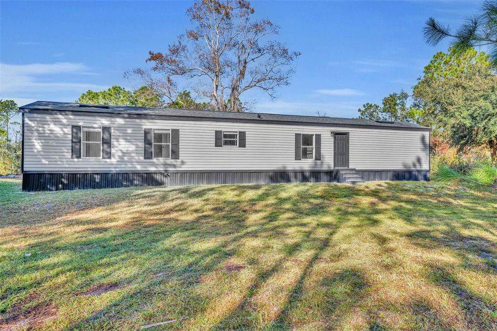 Photo of 6180 Winning Wood Trail, De Leon Springs, FL 32130 (MLS # V4946074)