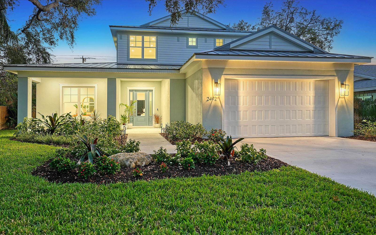 New, urban coastal residence in the Gardens of Ringling neighborhood in Sarasota’s desirable Downtown East. Wow, what a great location! Close to everything that makes Sarasota such a great place to live -- the Legacy Trail is just out the back gate, within one mile of Payne Park, downtown and Publix or Sprouts markets, and just two miles to Bayfront Park, Ed Smith Stadium, Sarasota Memorial Hospital and Southside Village. Love the beach? Climb aboard the complimentary Bay Runner trolley at its north terminus for a free ride over the iconic Ringling Bridge to Lido Beach with stops in downtown and St. Armands Circle. Light, airy and blissfully serene, this 3,352-square-foot residence reflects a coastal vibe comingled with urban chic. Large windows and high ceilings allow natural light to illuminate the open floor plan where common areas are connected for easy living. Quality construction includes concrete block first-floor, standing-seam metal roof, wide-plank luxury vinyl flooring, impact glass windows and sliding glass doors, solid-wood cabinets with soft-close mechanism, 8-foot solid-core interior doors, and screened-in outdoor kitchen, lanai and swimming pool. Luxury appointments include quartz countertops, kitchen island with waterfall detail, Bosch kitchen appliances, contemporary lighting and laundry on each floor. Private areas include four bedrooms, three full baths and two half baths. The primary suite on the first floor has a spacious bedroom, oversize walk-in closet with dual sections, laundry alcove and en-suite bath. Three additional bedrooms are on the second floor, along with two baths, loft and laundry closet. A home office is on the first floor. This home loves the outdoors, too. Sliding glass doors lead to a large covered lanai featuring an outdoor kitchen with built-in grill, chimney vent, stainless sink and under-counter refrigerator. This entire area is screened-in along with the swimming pool. The backyard is surrounded by easy-care landscape, and a privacy fence with gate access to the Legacy Trail. Gardens of Ringling in Downtown East is an established neighborhood with easy access to Sarasota’s exceptional amenities. Welcome home to an urban coastal retreat with livable comfort.