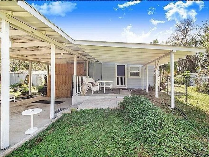 Your own private lake and canal on this 4 bedroom, 3 bath home and plenty of room on this 1.5 lot property. Extensive remodeling and addition in 1986 provides large family room with direct access to wrap-around porch on the lake and added 1100 sq ft to the home, bringing the total size to 2000 sq ft.  Roof is 3 years old, fixtures, fans, drapes, paint, flooring etc have all been done.  Large shop, 12 x 30 which is metal on a concrete foundation also contains a man cave or office.  Large kitchen connects to dining area and is quite spacious. Nature lovers, fishermen and boaters, enjoy 1000 acre Lake Lowery year round in your own lake house.