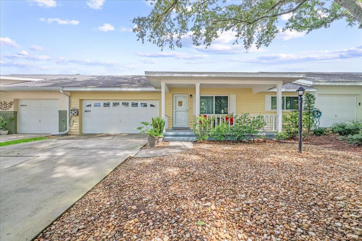 Spacious Montgomery Model Villa located in On Top of the World, 55+ gated golf community in SW Ocala FL. This is a 2 bedroom, 2 bath, 2-car garage villa located on a tree-lined street with Green Space across the street! ROOF 2017, HVAC 2021, ENERGY WINDOWS 2020! Nice long wide driveway leads to inviting front porch with Green Space views – perfect to enjoy your morning coffee, or evening beverage to meet/greet your neighbors! Step inside into the living room – notice the beautiful laminate flooring. The bedrooms are on the right side of the home, with the guest bedroom in front with spacious closet. The guest/hall bath divides the bedrooms. The primary bedroom is in the back for privacy with large walk-in closet and en suite bath with step-in shower w/custom tile. The kitchen has been nicely updated with new counters, appliances, and more! The family room is adjacent to the kitchen and provides table space and lounging space > perfect for entertaining! Step out into the finished Florida room! The 2-car garage is off the kitchen and the laundry is located there. Exterior of home was freshly painted late 2024. The monthly HOA fee includes Basic Spectrum Cable, irrigation water, roof repair, exterior painting every seven years, exterior maintenance and insurance, landscaping, trash & recycling, 24/7 monitored gates and what seems like endless amenities; three pools (2 outside & 1 inside & another under construction), two state of the art fitness centers, pickleball (uncovered & covered), billiards, archery range, corn hole, bocce ball, tennis, shuffleboard, horse shoes, remote control flying field and race cars, 175+ clubs, woodworking shop (extra fee), library, and much, much more! A golf cart community with access to several shopping centers. Centrally located 20 minutes from the World Equestrian Center, easy drive to 4 cruise ports and/or airports, and within a close proximity to entertainment complexes in Orlando. FURNITURE AVAILABLE OUTSIDE PURCHASE OF THE HOME - COULD BE TURN-KEY OPPORTUNITY!