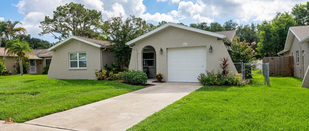 Photo of 1633 St Catherine Drive E, Dunedin, FL 34698 (MLS # TB8537696)